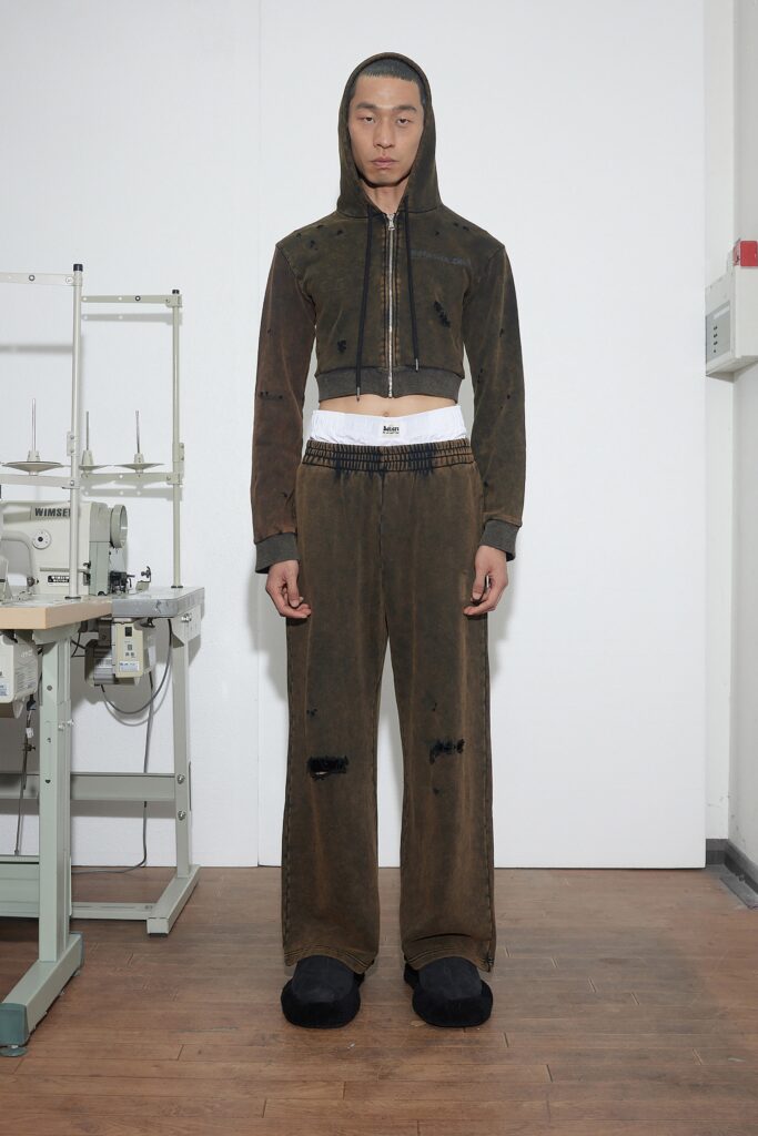A relaxed brown denim jacket with a hood paired with matching relaxed-fit pants.