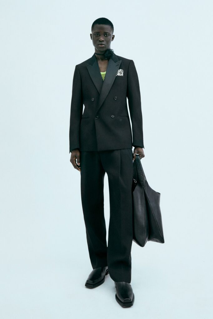 black tailored suit with bag
