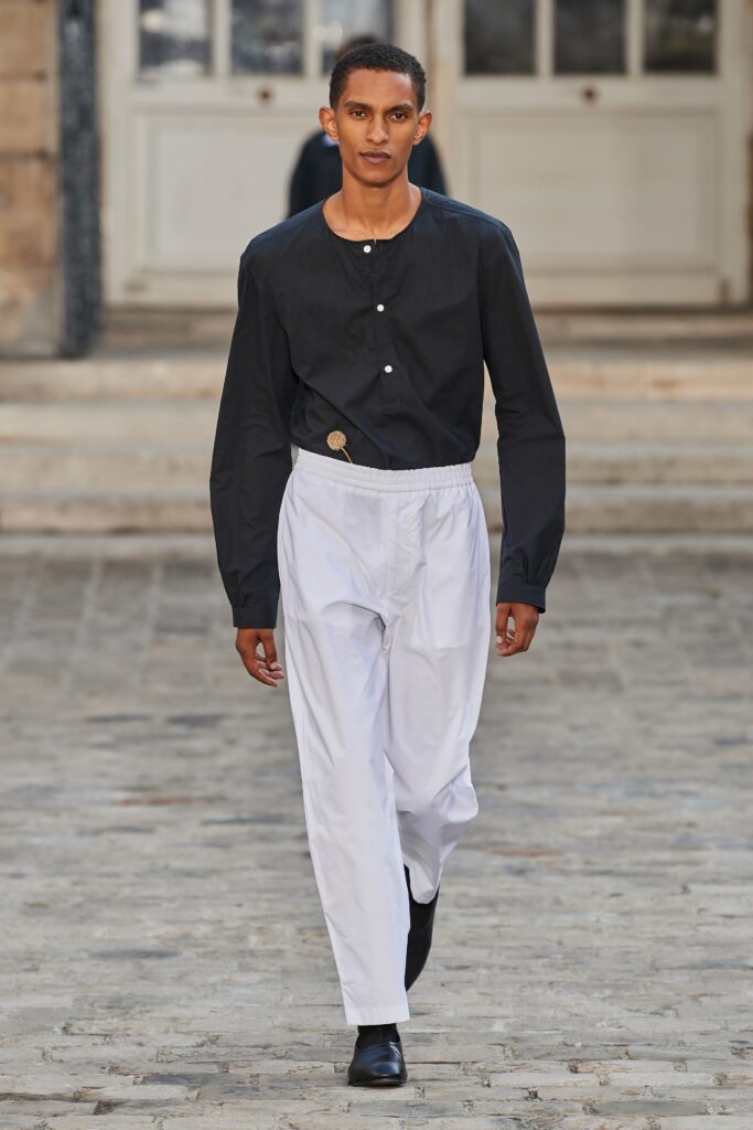 black shirt and white pants