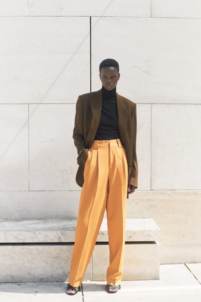 brown tailored blazer with orange pants