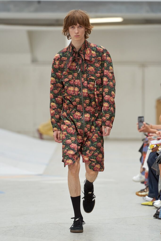 A relaxed multicolor printed jumpsuit with a collared neckline and short sleeves.