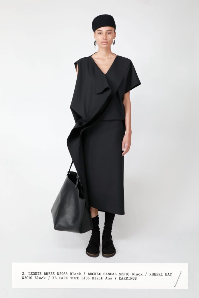A fitted black sleeveless dress with a V-neckline and asymmetric design detail.