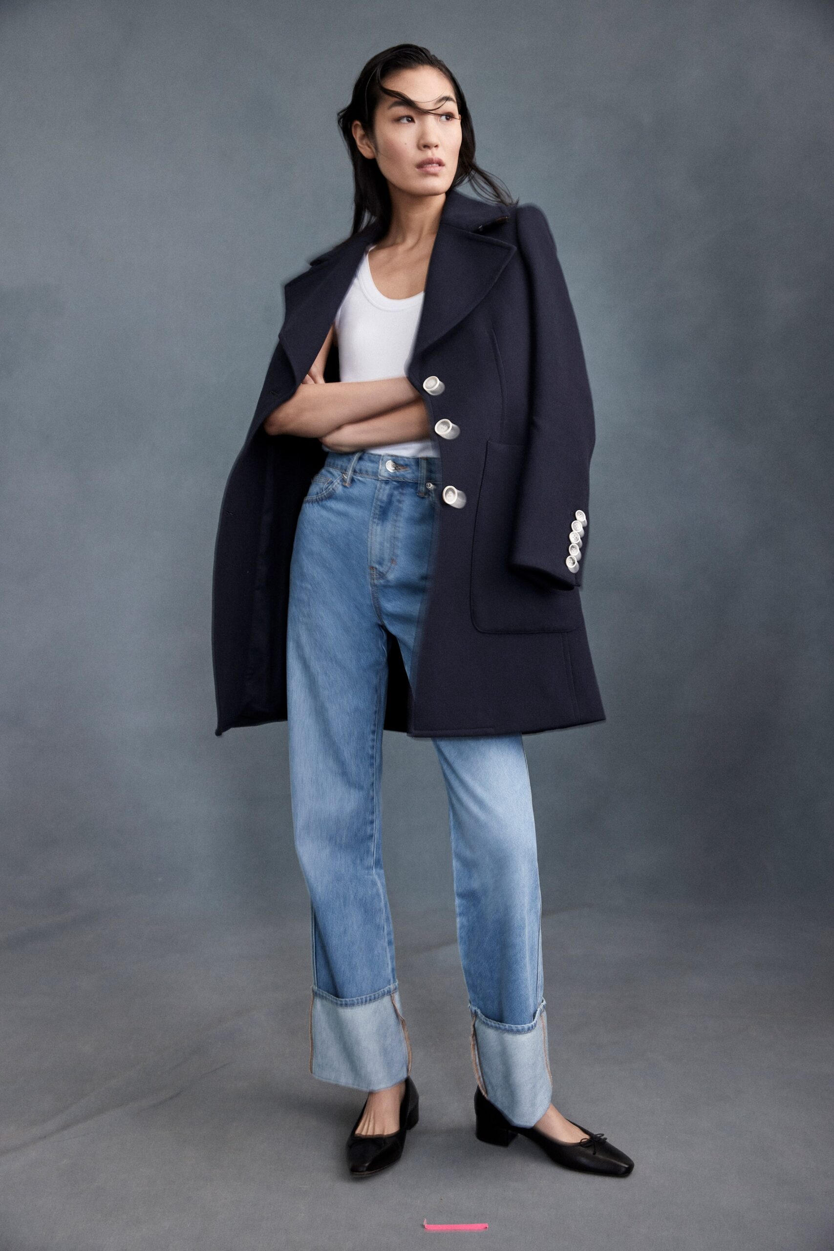 navy wool tailored coat with jeans
