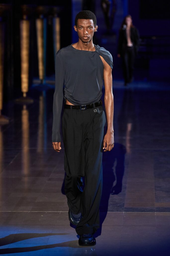 gray asymmetric top and black pants