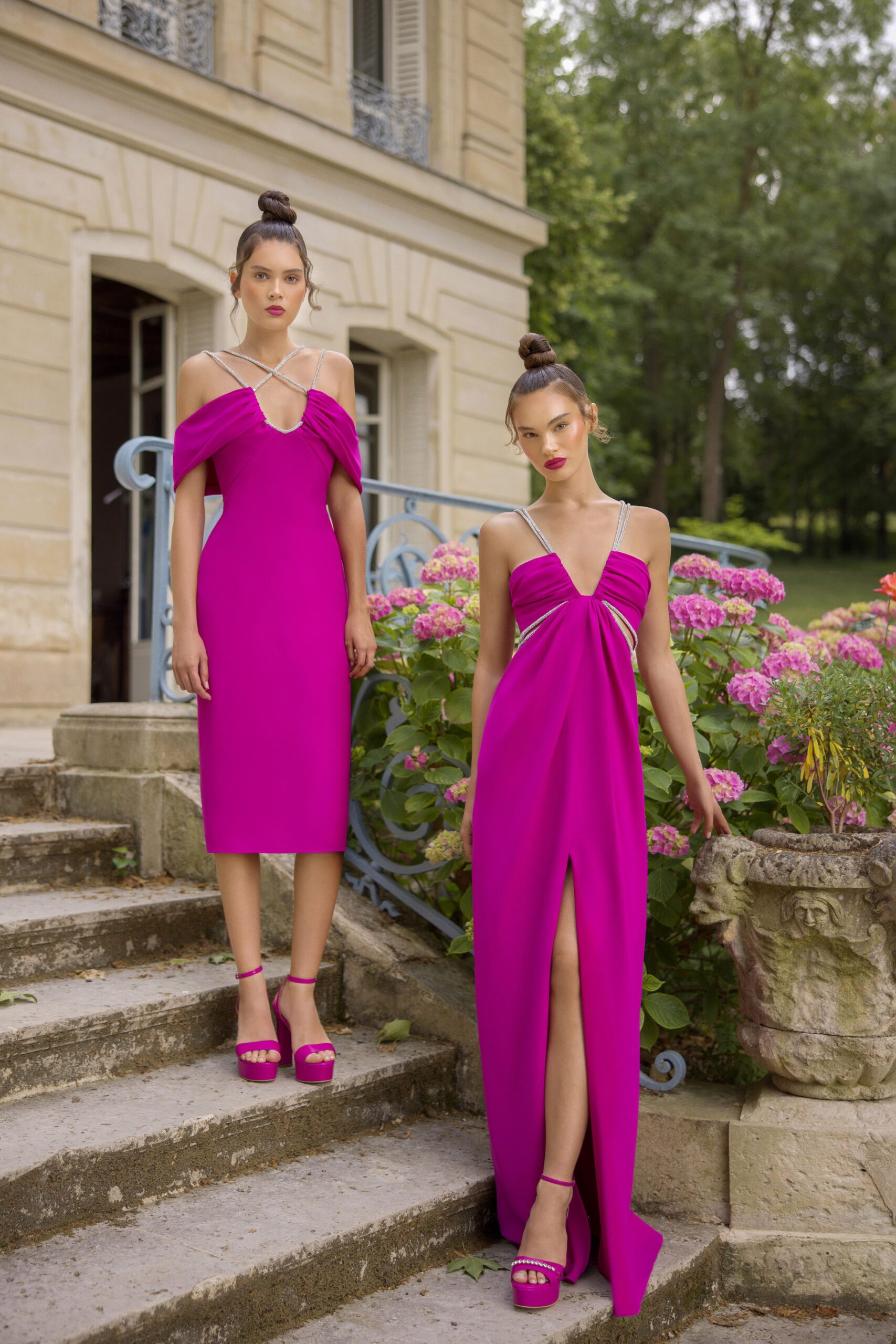 A fitted pink silk dress with a V-neckline and a stylish slit detail.