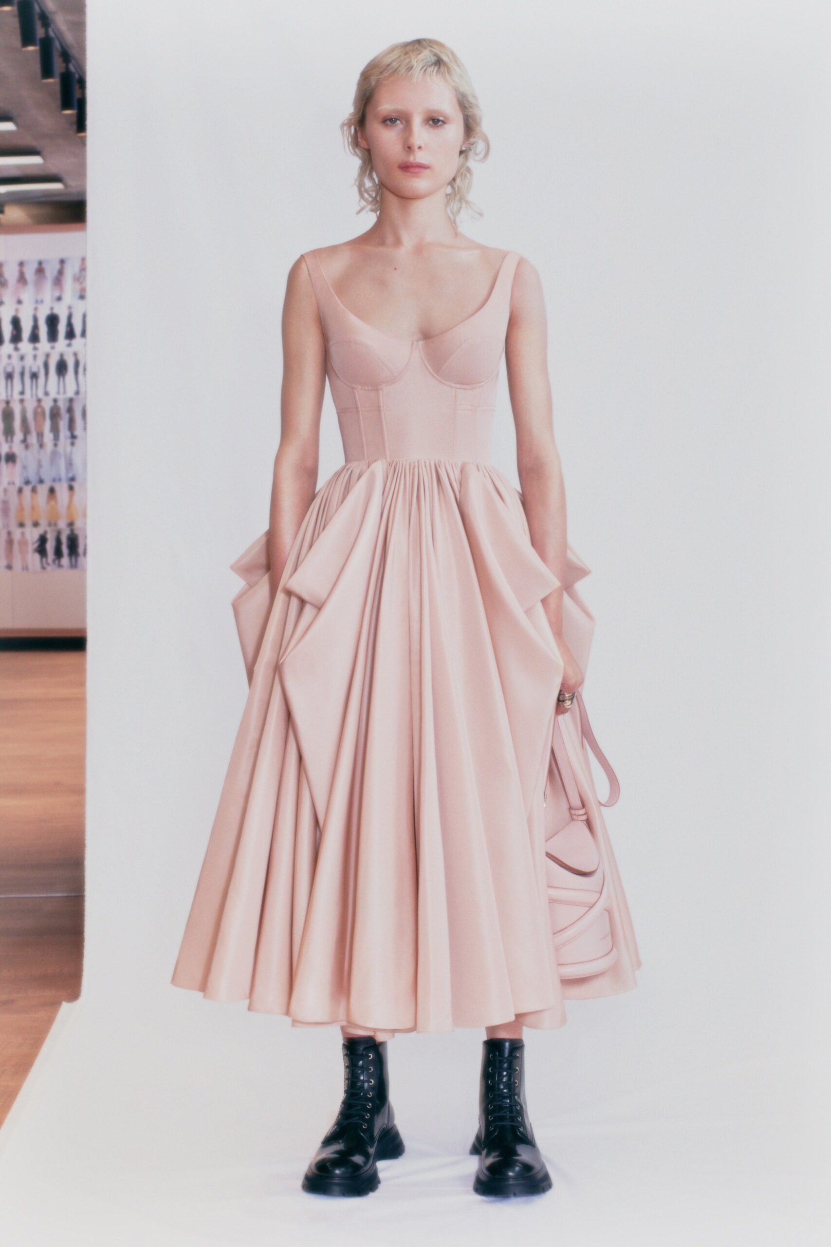 pink pleated midi dress with black boots