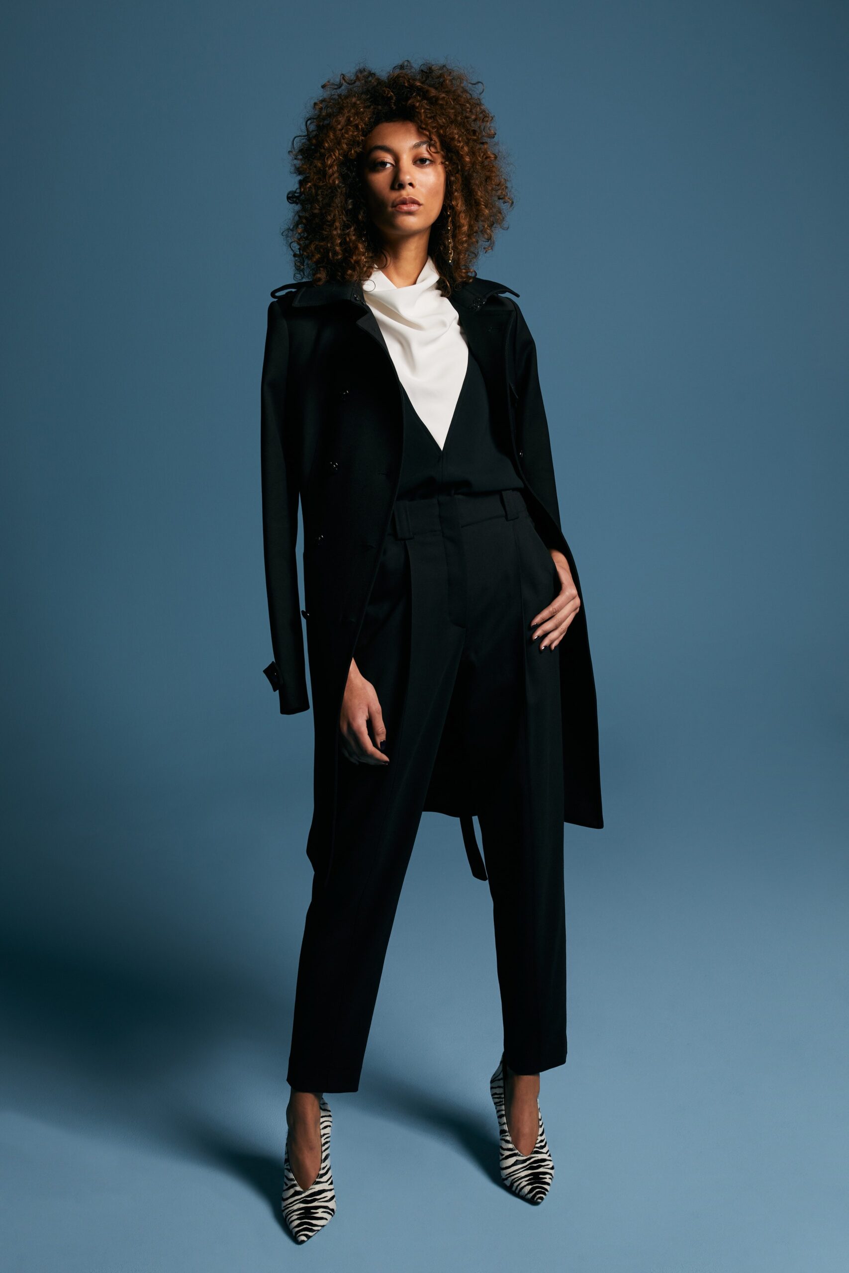 black tailored coat with white blouse