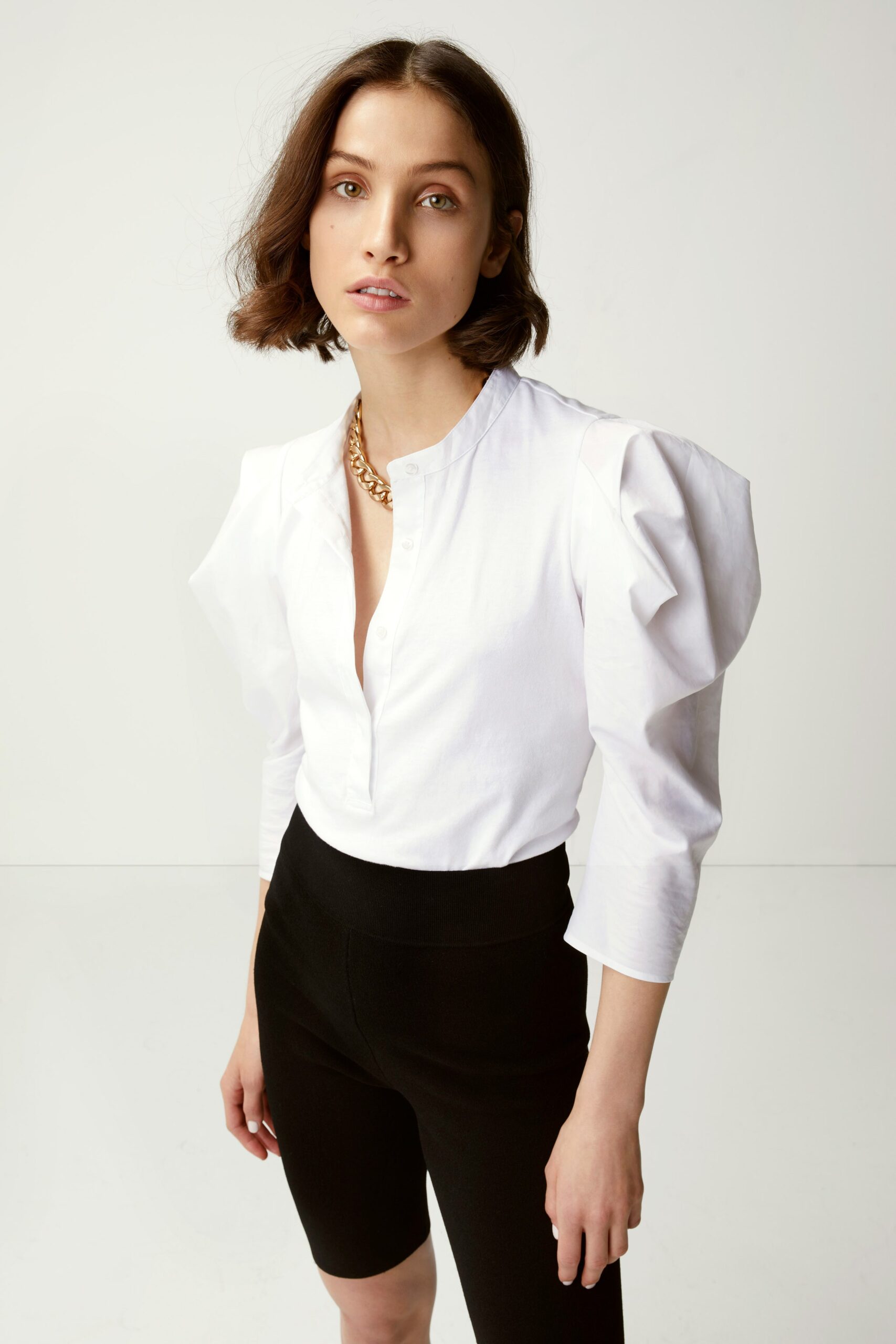 white cotton long-sleeve collared fitted padded blouse