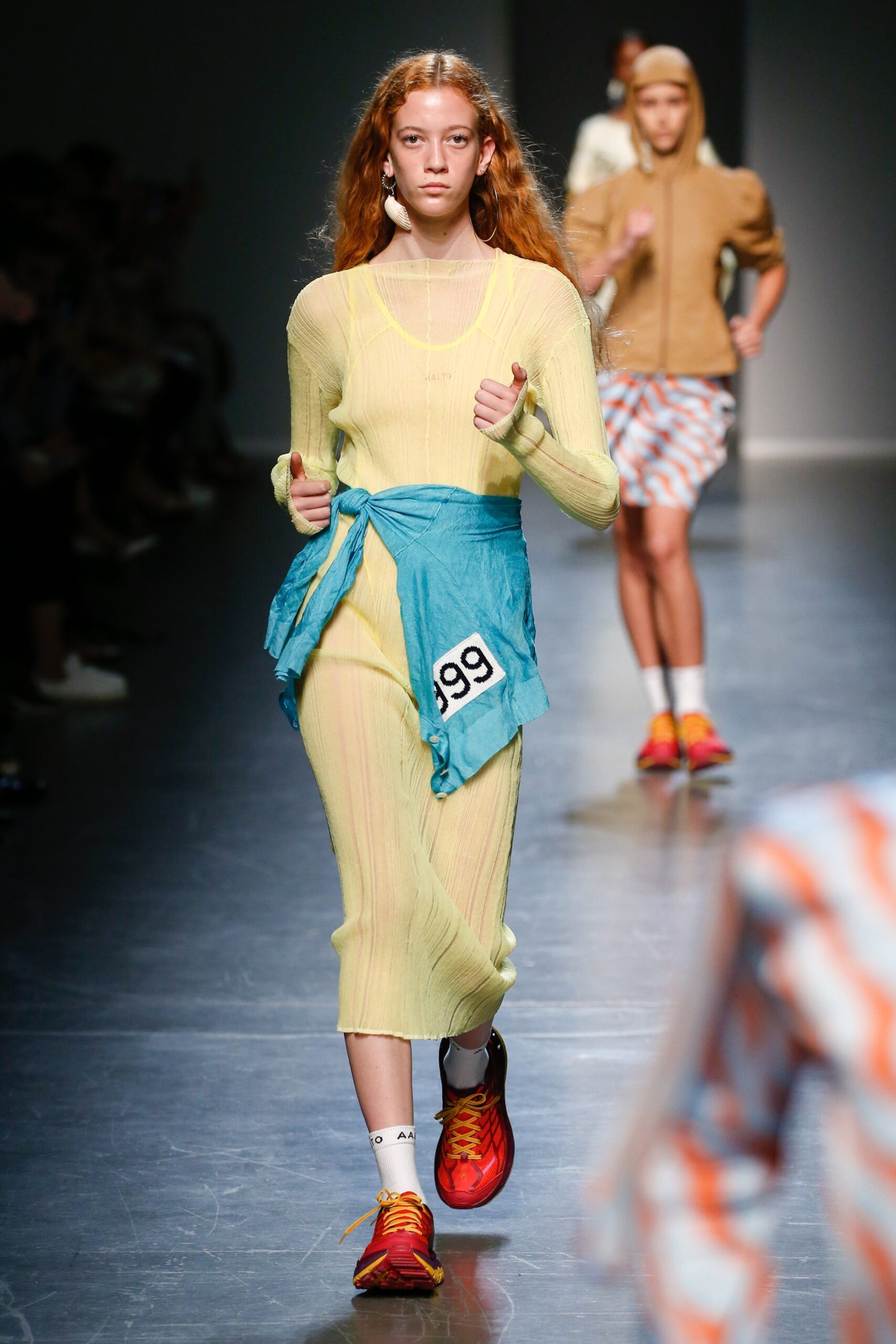 yellow fitted midi dress with blue sweater