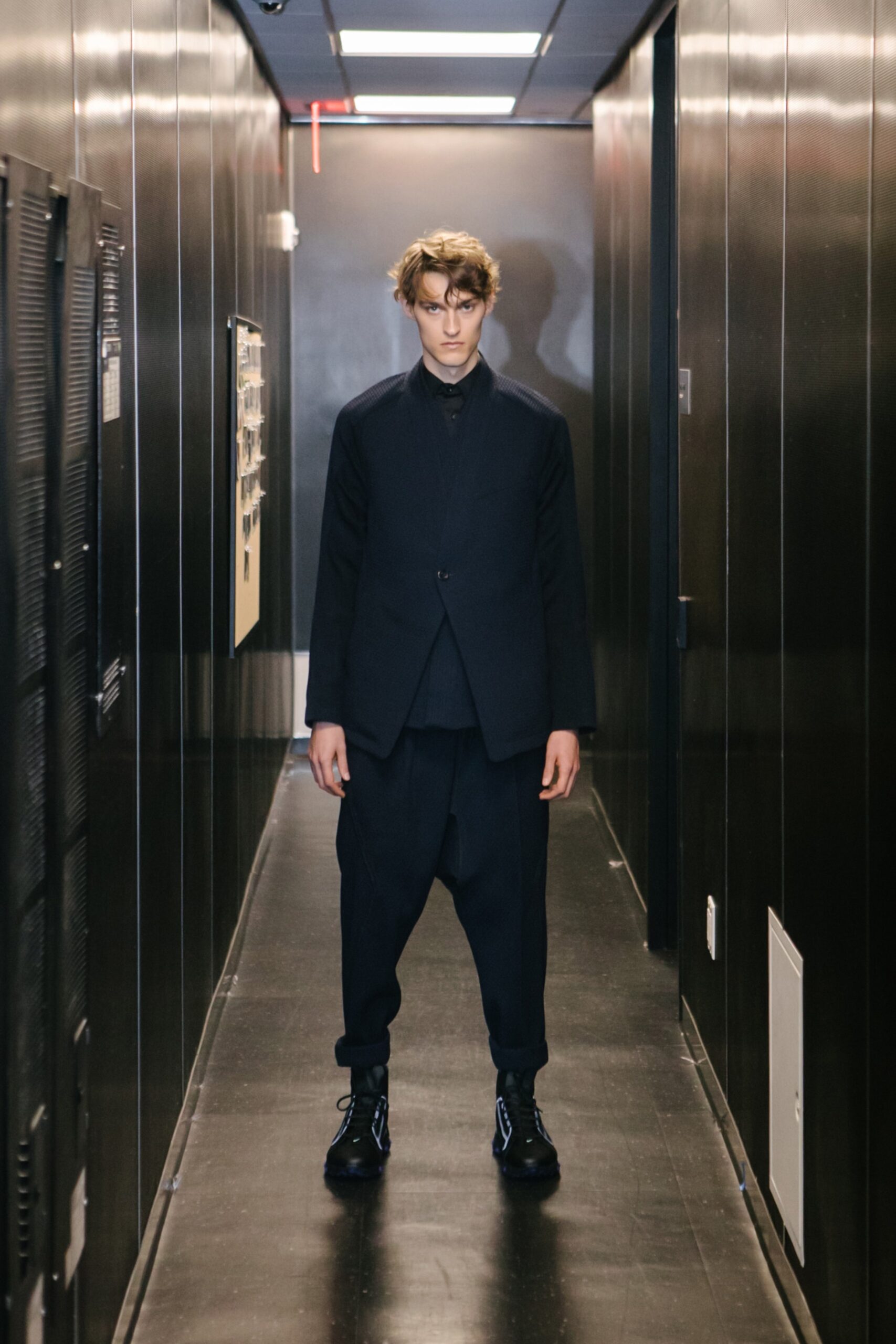 black tailored suit with relaxed pants