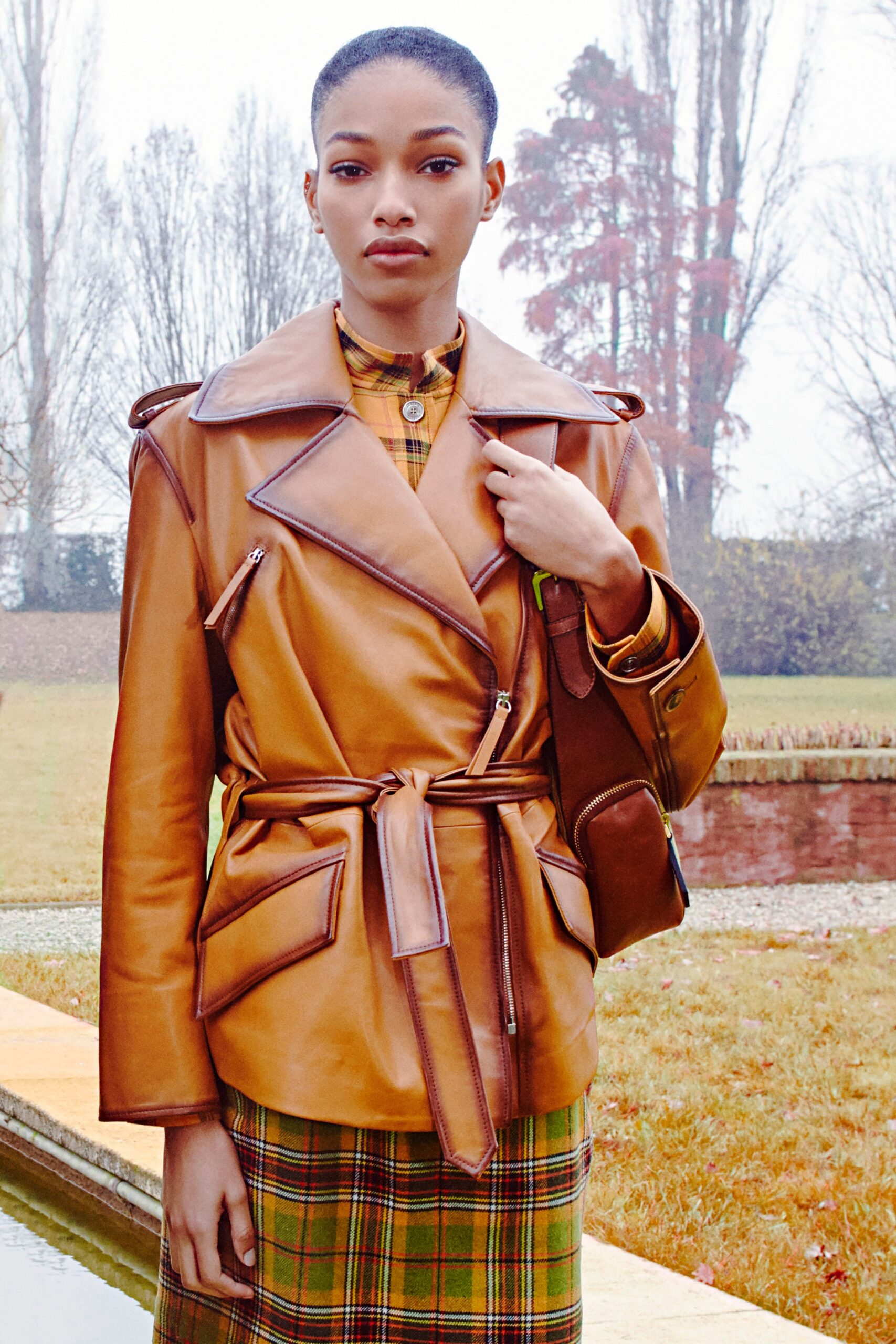 brown leather fitted jacket and green checked dress