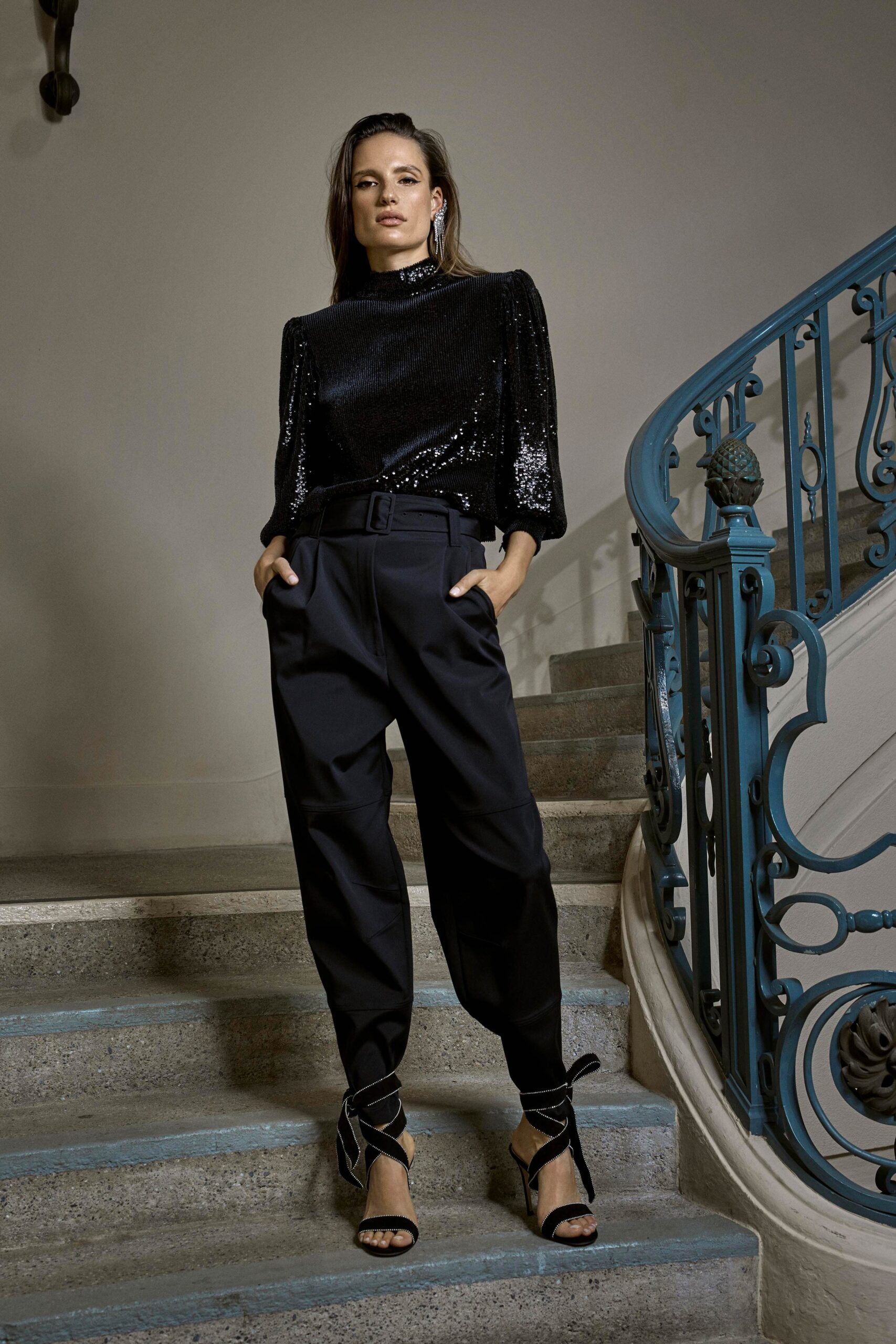 black sequined top with relaxed pants
