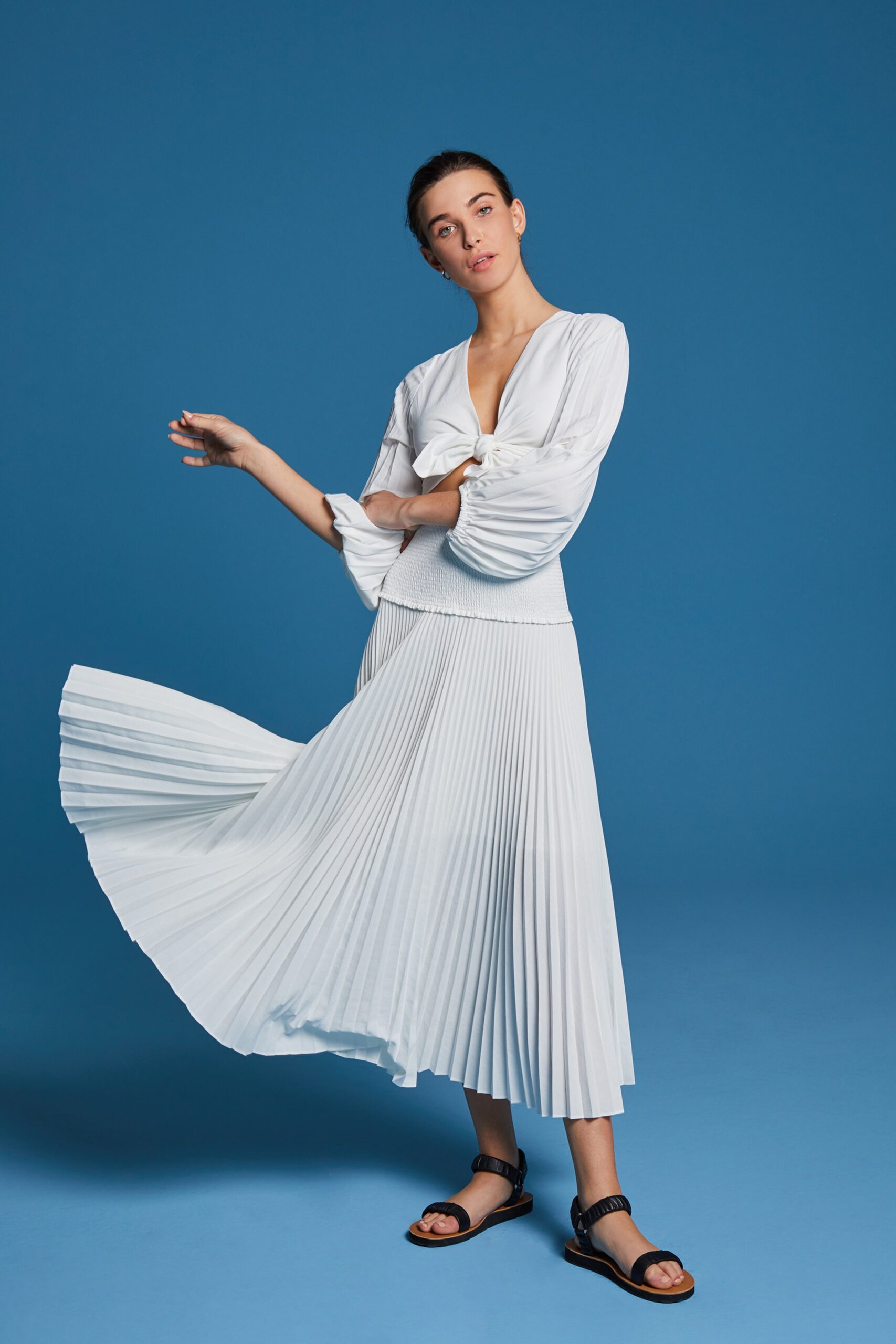 white pleated top and skirt