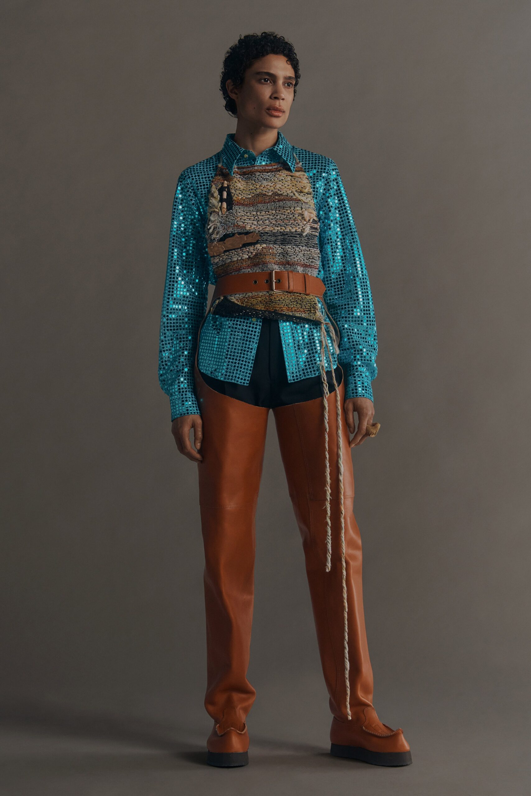 blue sequined shirt with leather pants