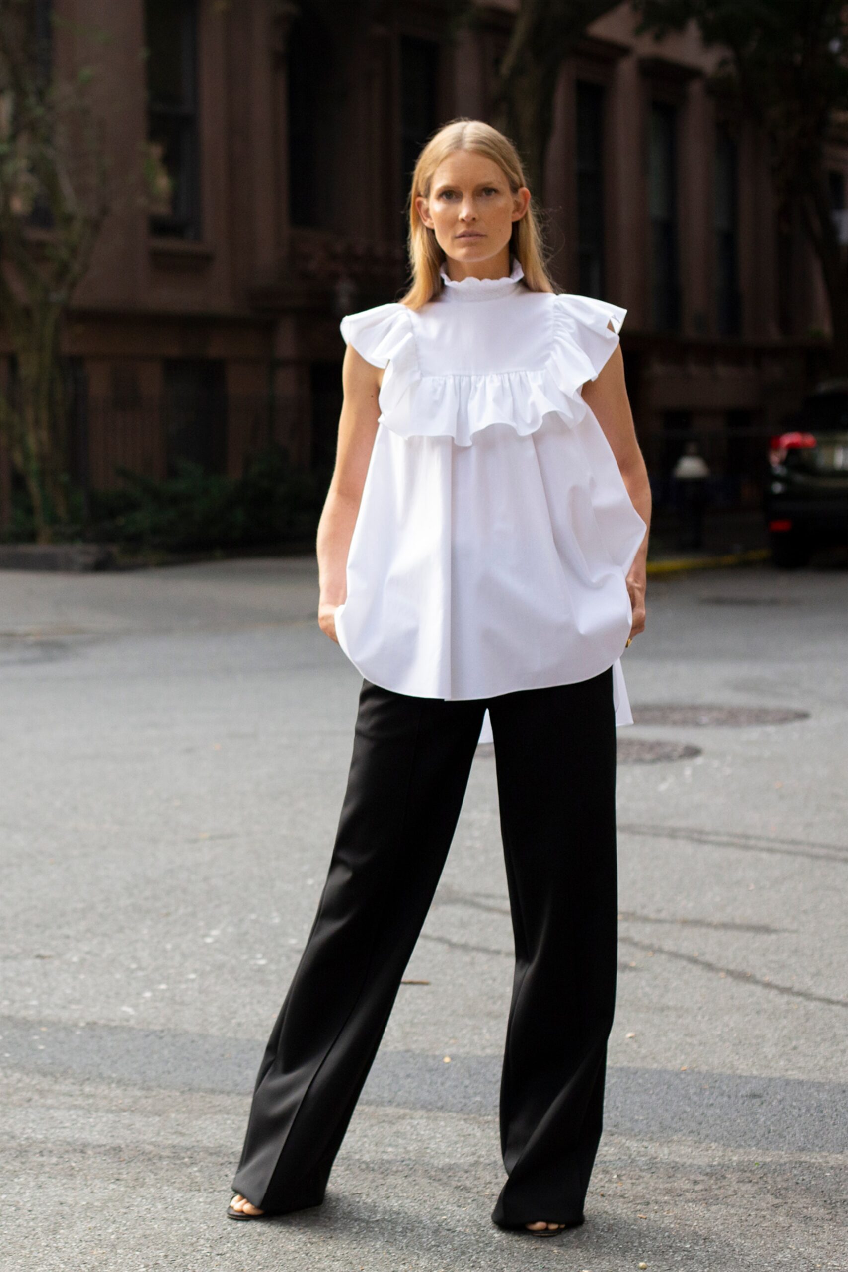 white cotton sleeveless high-neck relaxed ruffled top