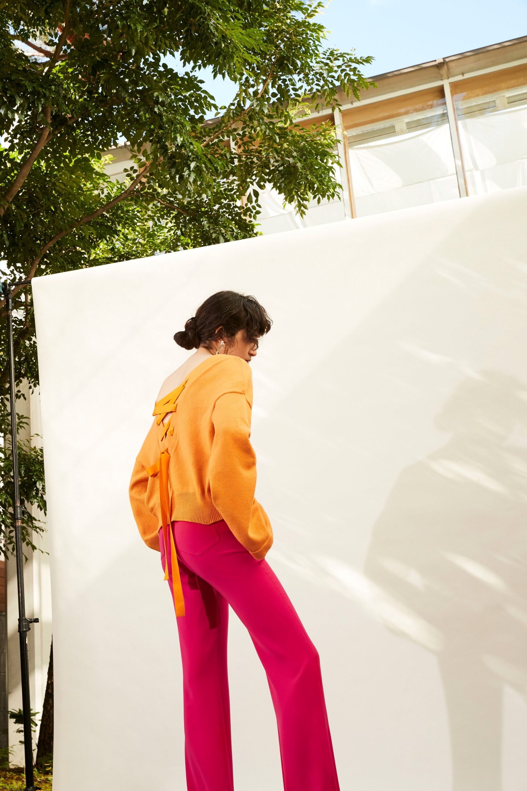 orange hooded sweater with pink pants
