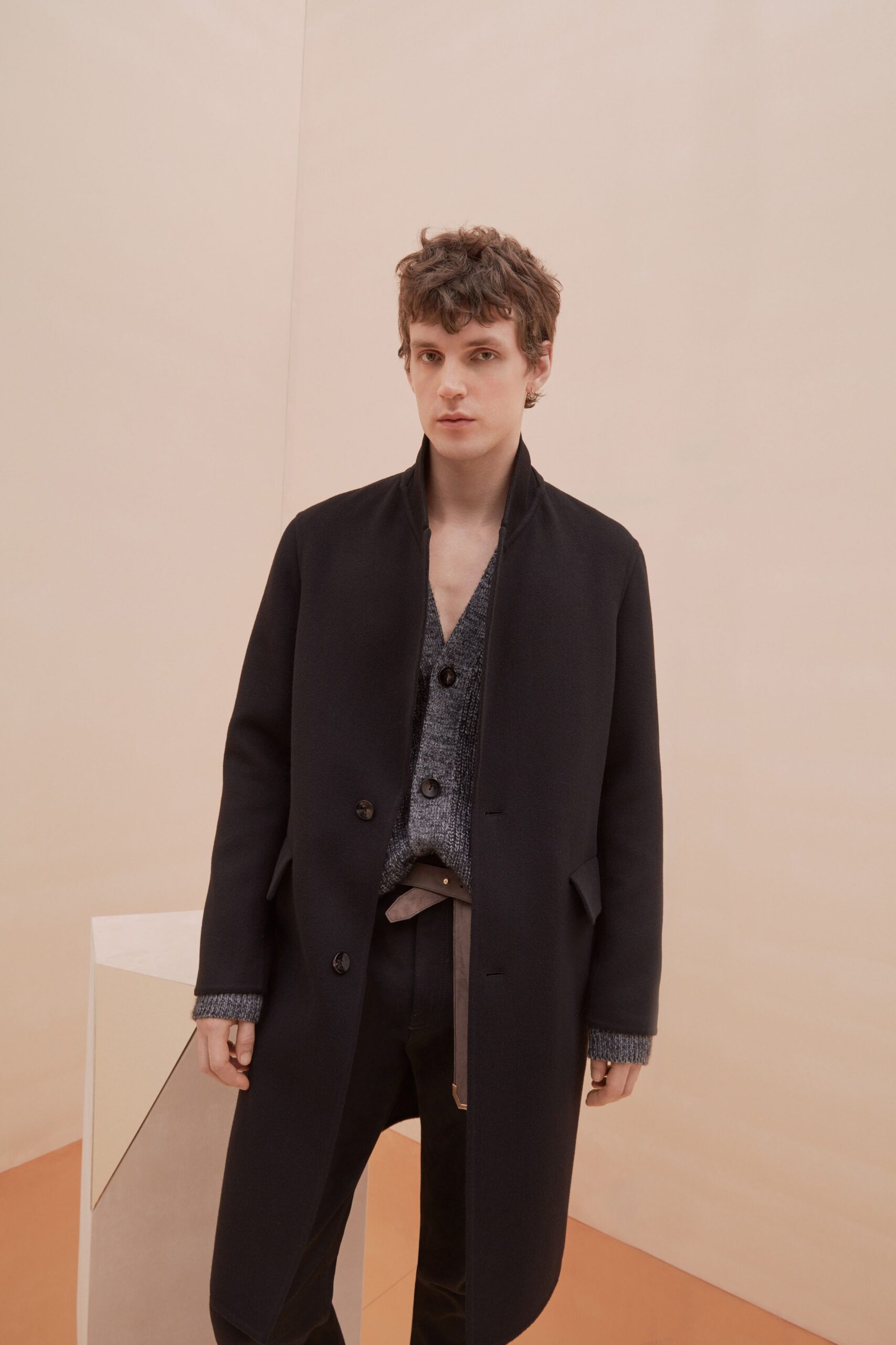 black tailored coat gray sweater