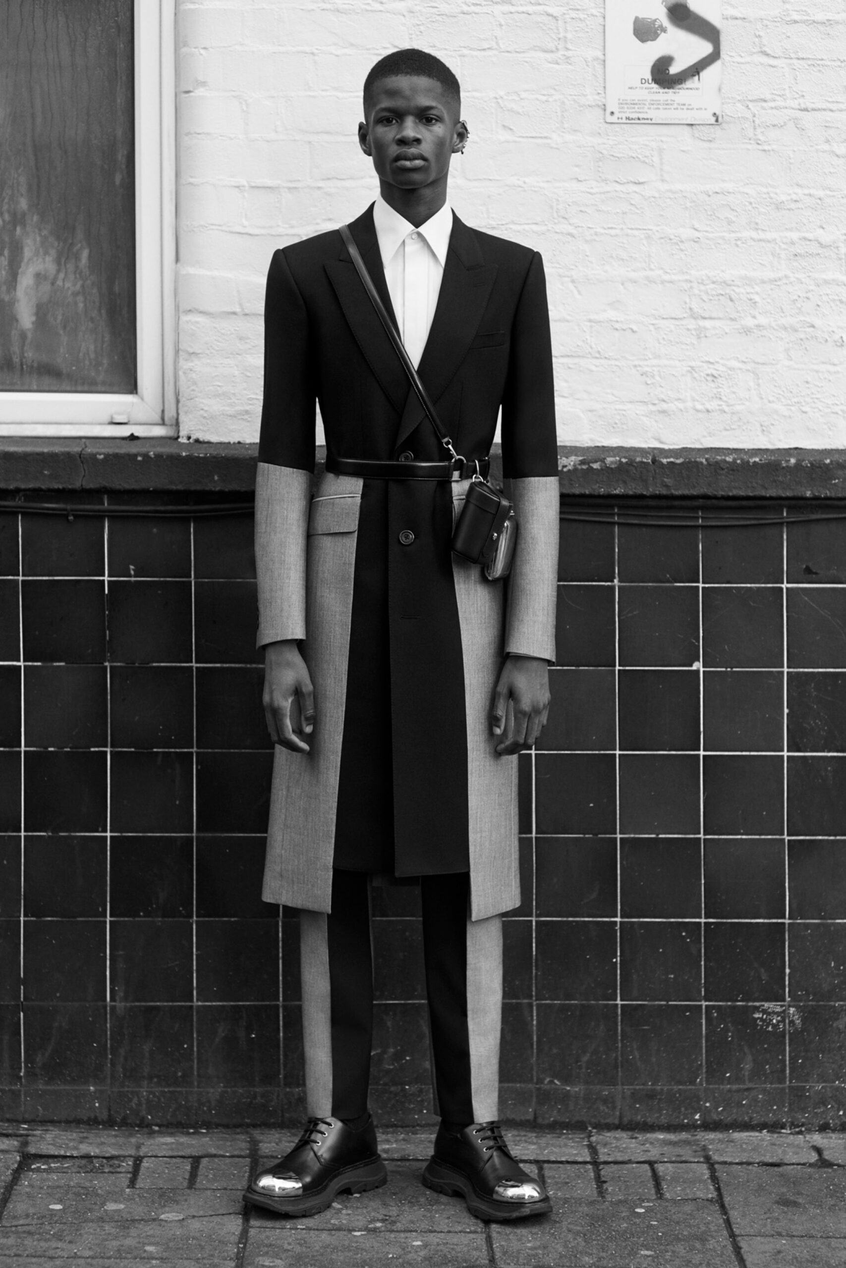 black wool long-sleeve collared tailored buttoned layered coat