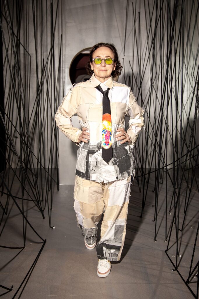 A relaxed-fit beige printed jacket paired with matching pants, featuring a collared design.