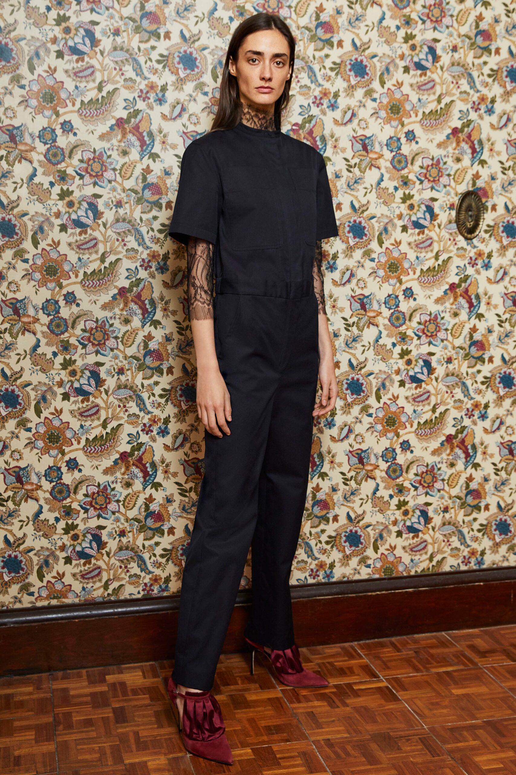 black fitted jumpsuit with purple shoes