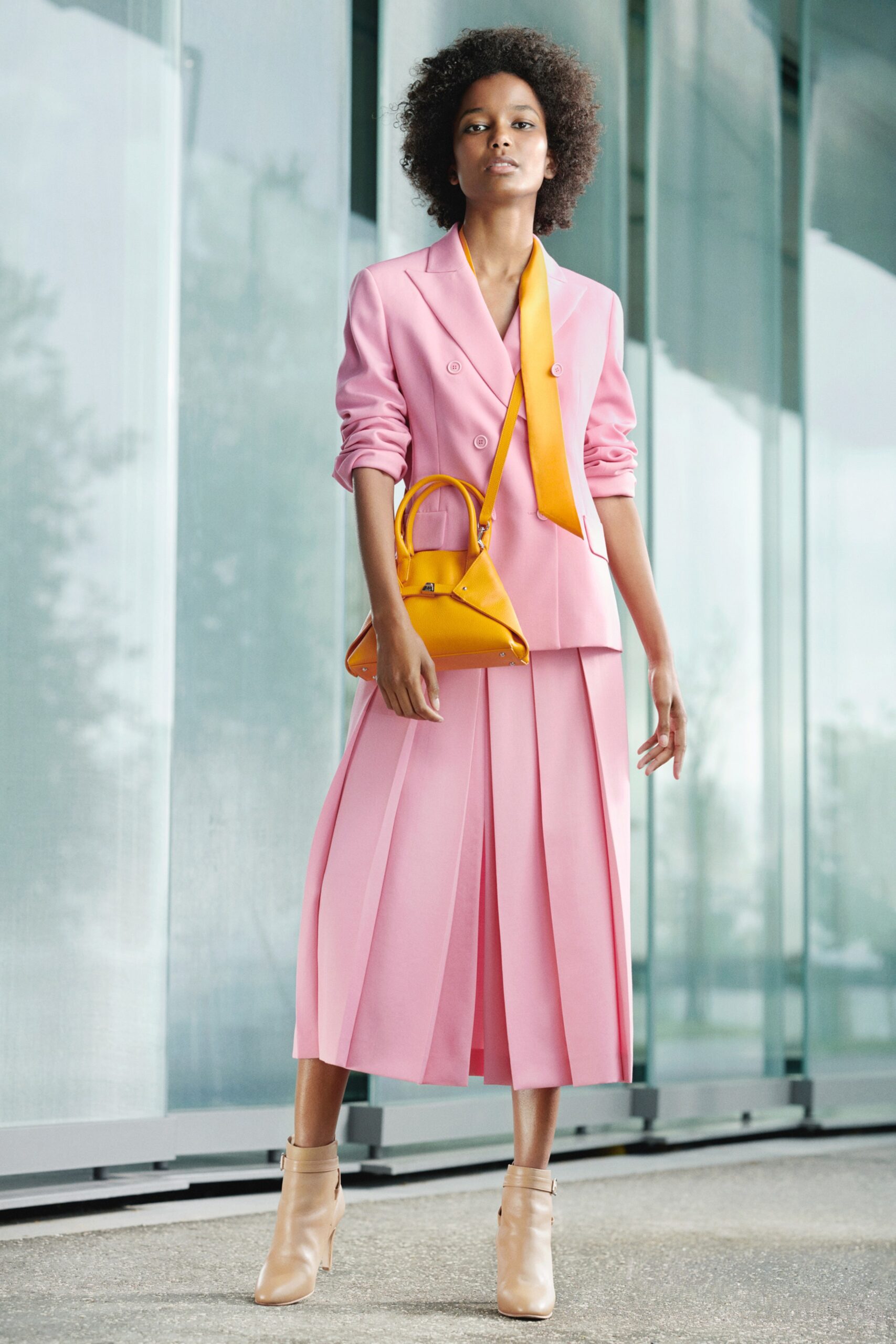 pink tailored blazer and midi skirt