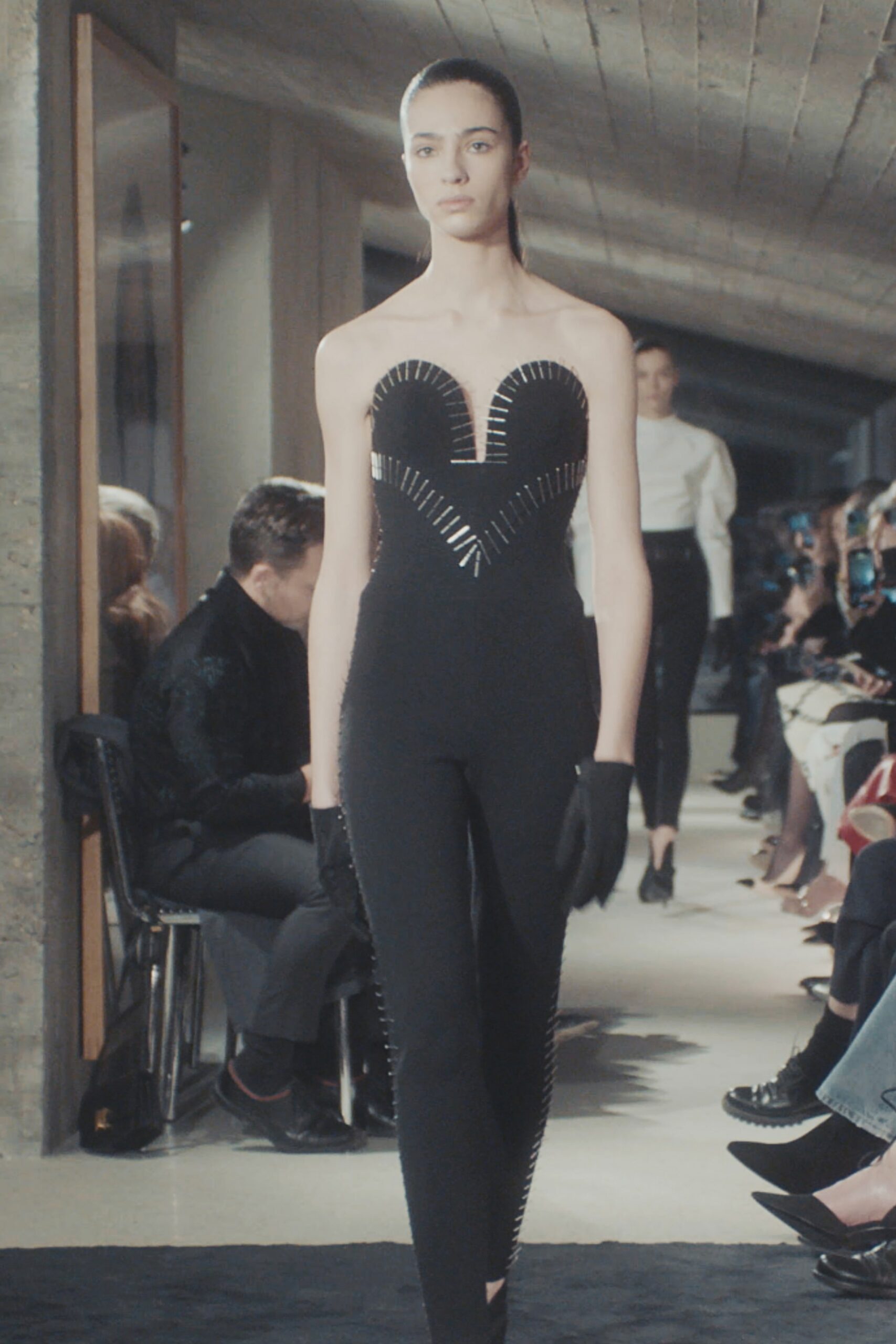 black cotton sleeveless high-neck fitted zippered embellished catsuit