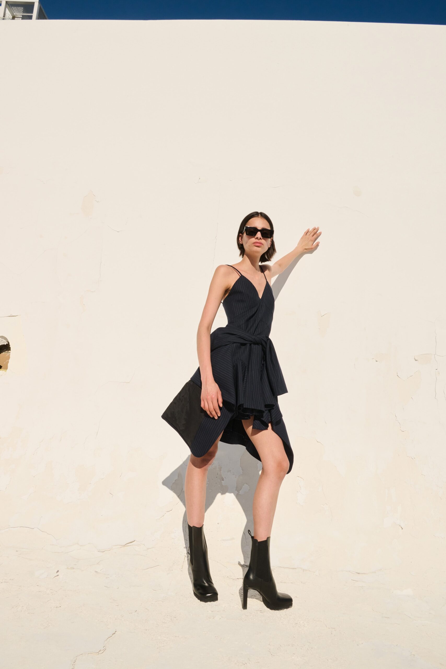 black fitted mini dress with boots
