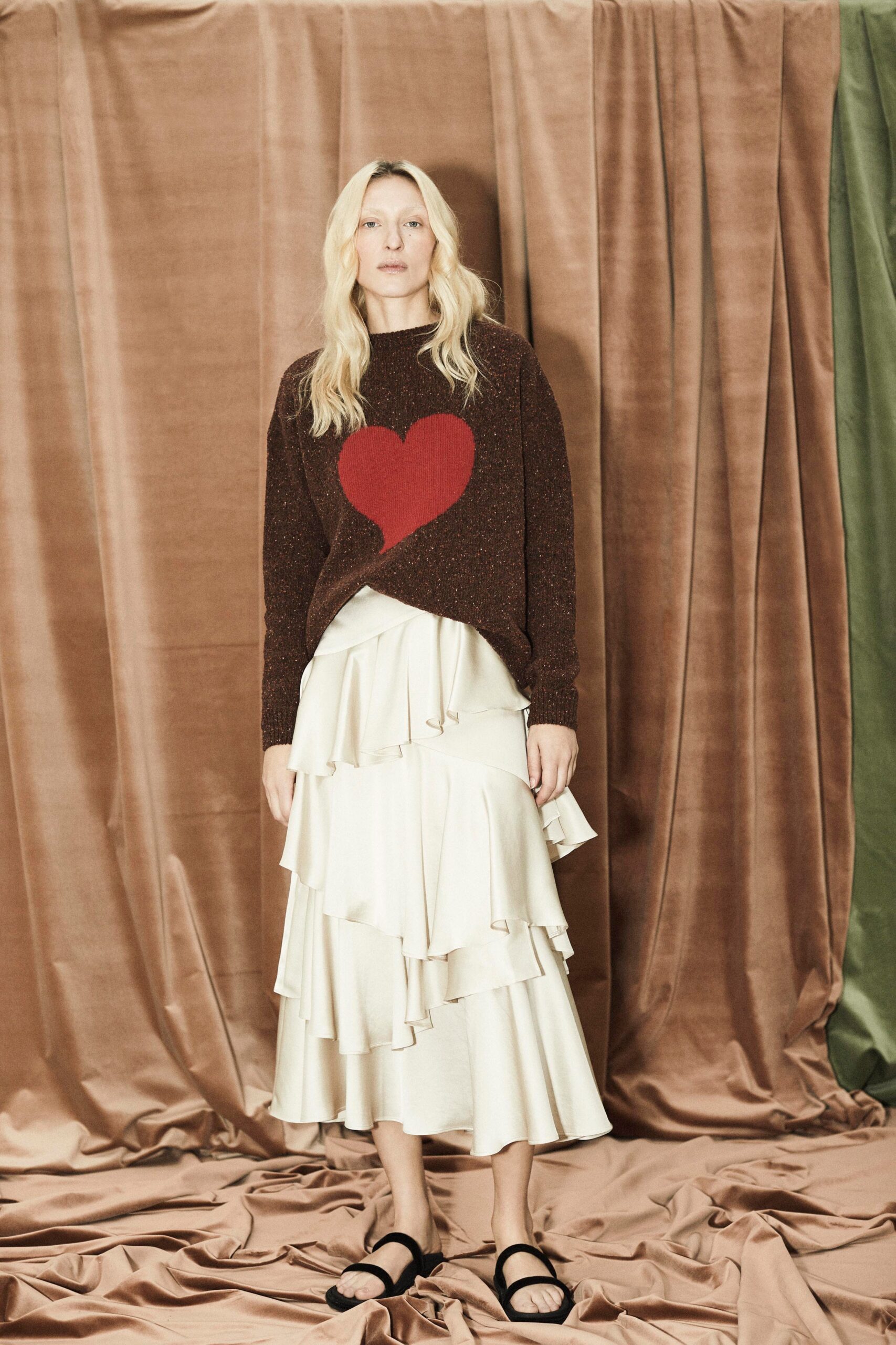 brown sweater with heart and white tiered skirt
