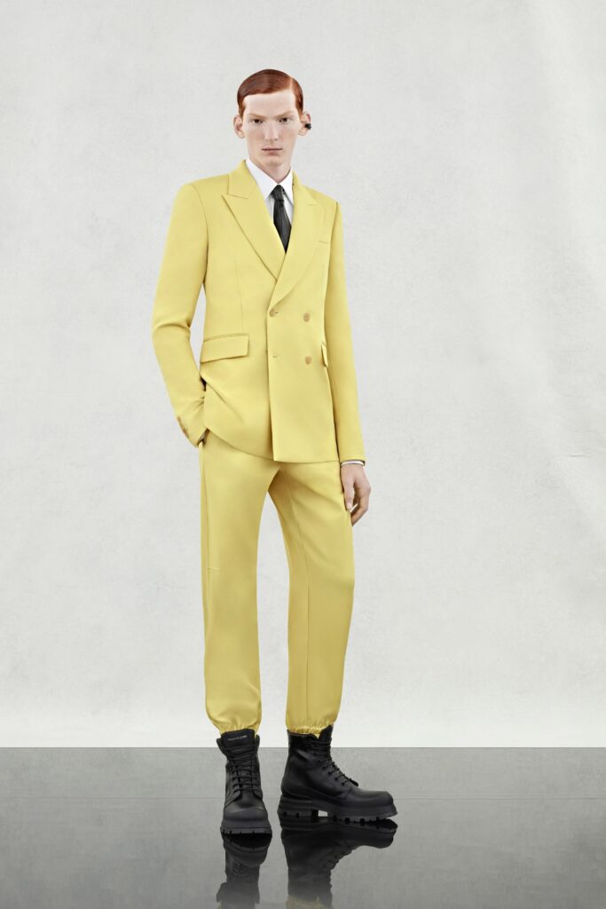 A tailored yellow suit with a double-breasted design and long sleeves.