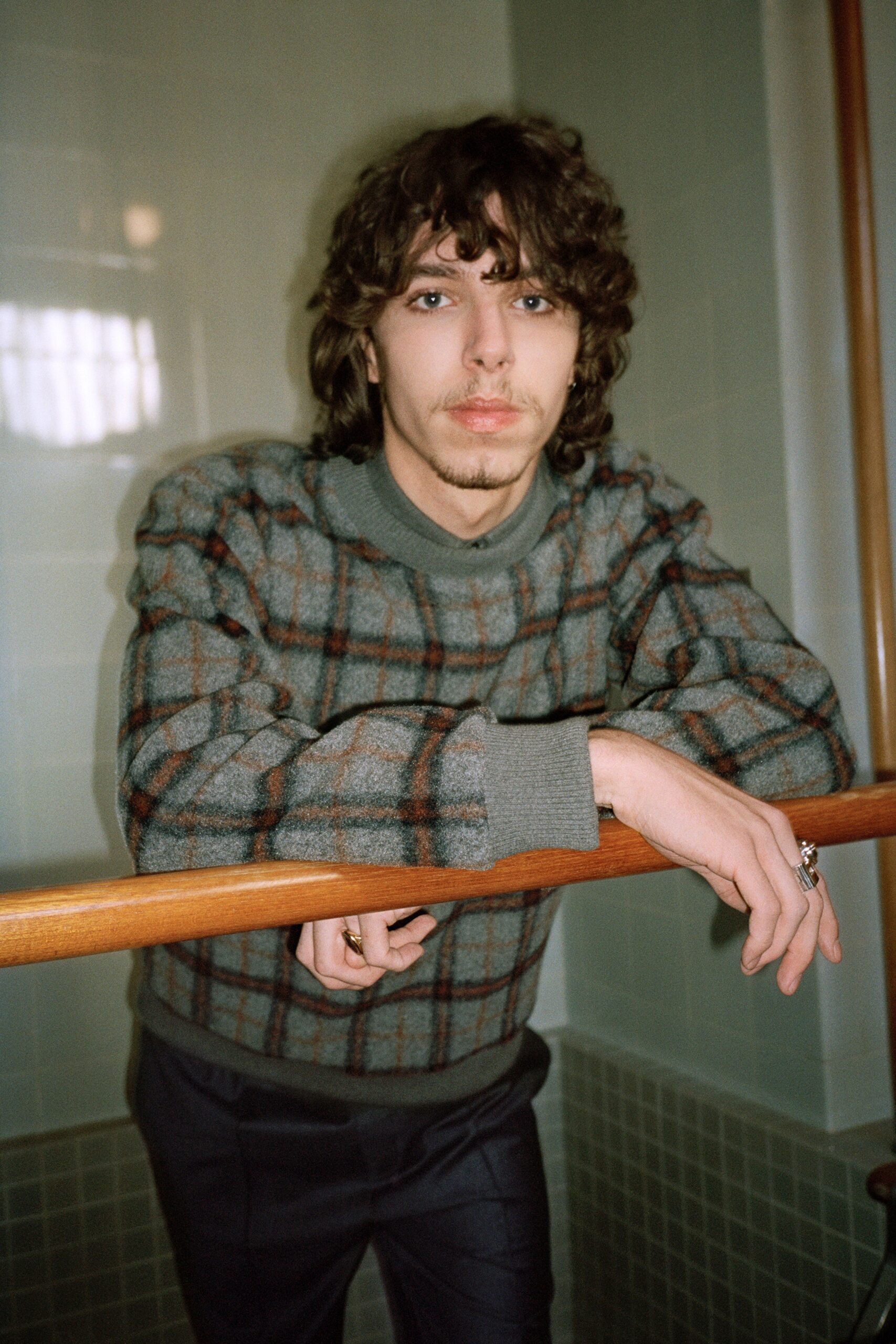 gray checked sweater with black pants