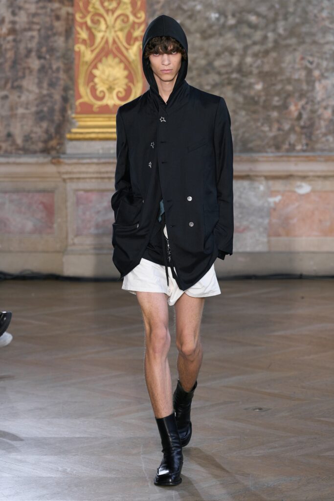 black hooded jacket with white shorts