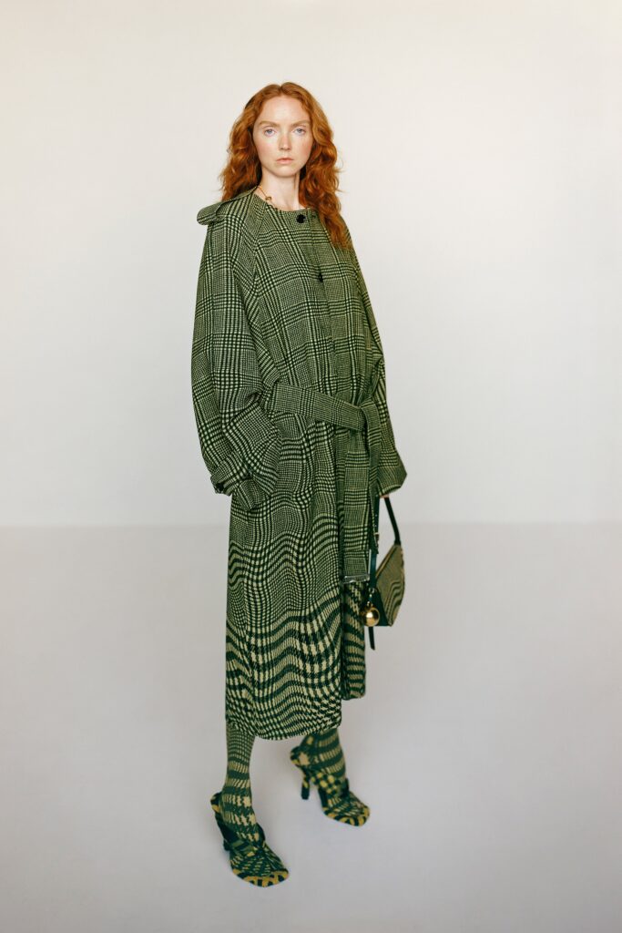 A relaxed green checked dress with long sleeves and a collared neckline.