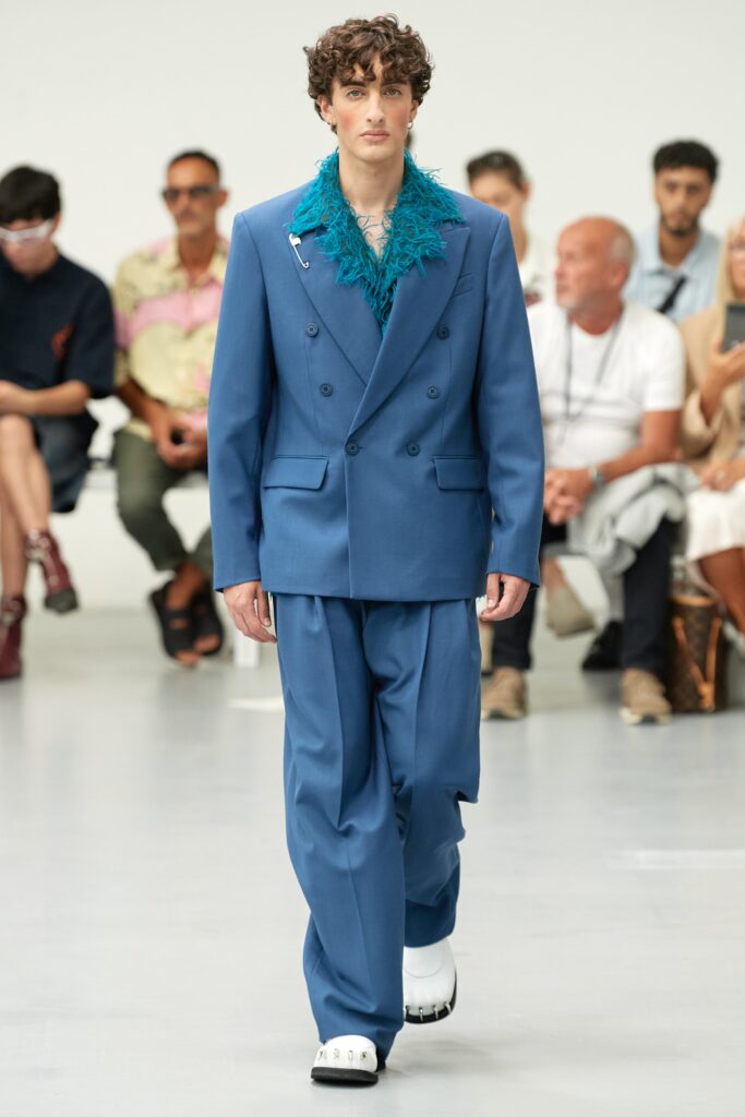 A tailored blue suit with long sleeves and a double-breasted design.