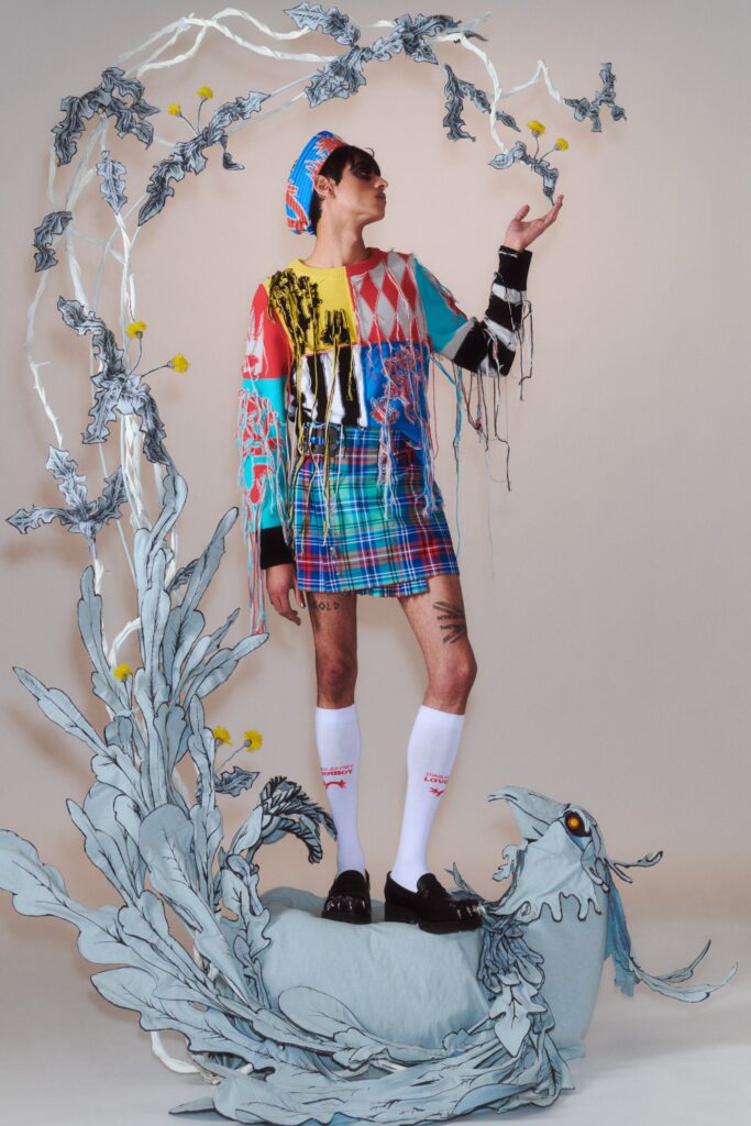 A relaxed multicolor dress with long sleeves and an asymmetric layered design.