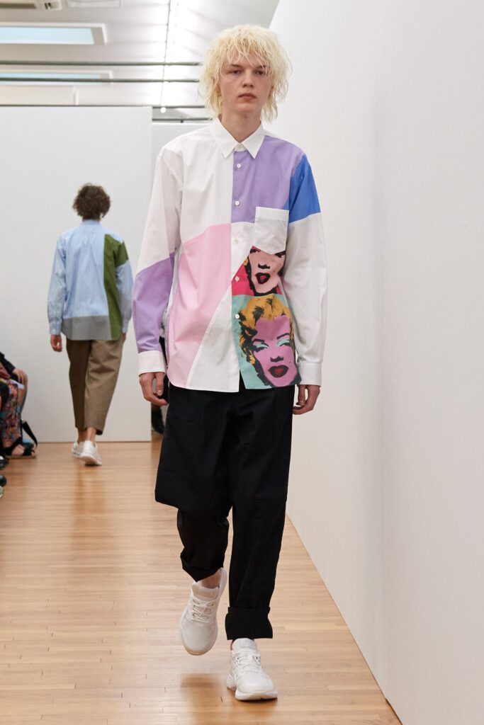 A relaxed fit long-sleeve color-blocked shirt paired with black pants.