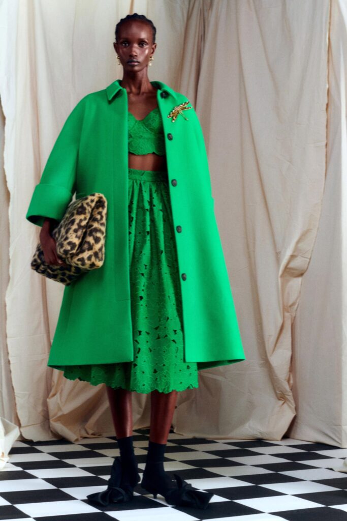 green oversized coat with embroidered skirt
