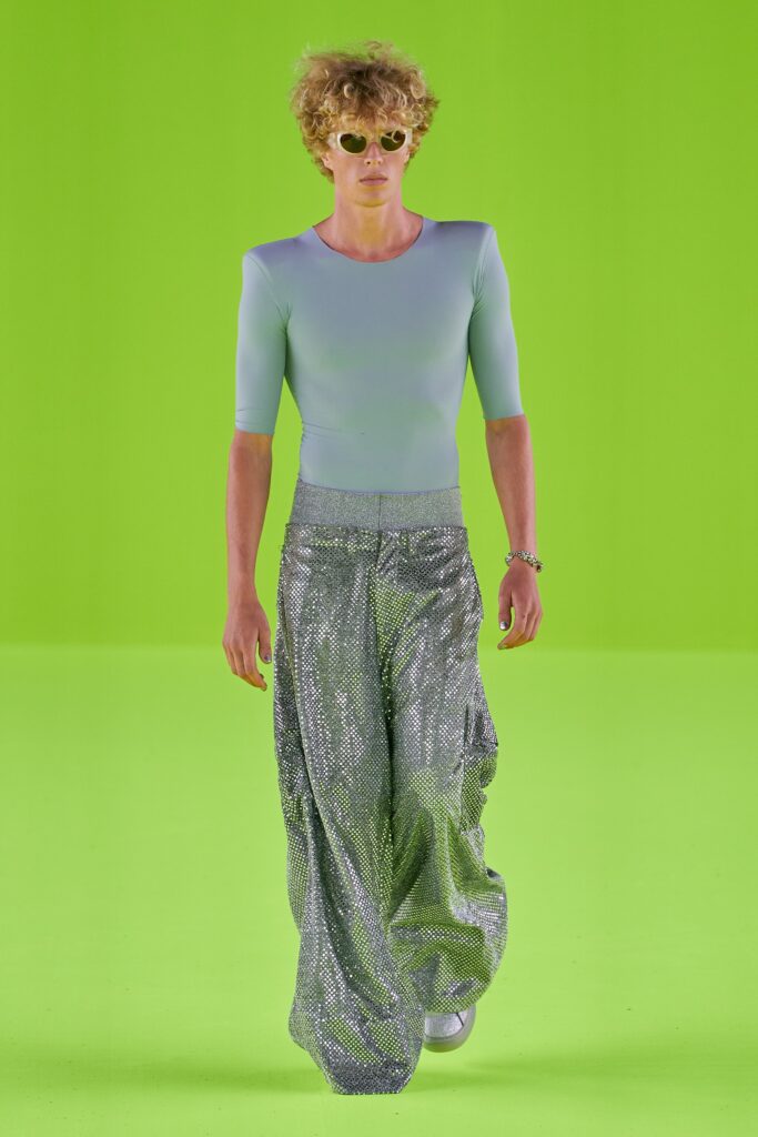 A relaxed blue mesh top paired with wide-leg silver sequined pants.