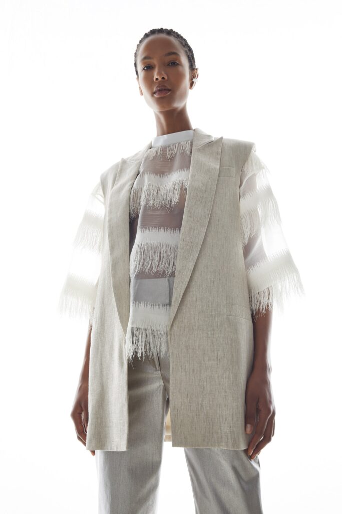 white silk blouse beige blazer gray pants