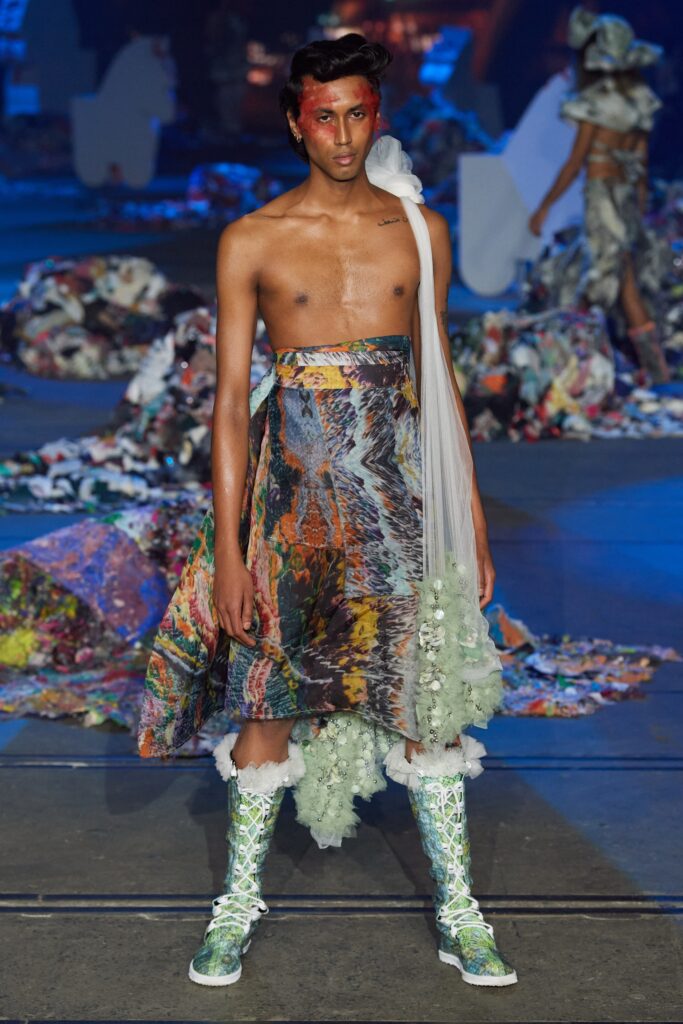 A relaxed multicolor skirt paired with a sleeveless top featuring an asymmetric design.