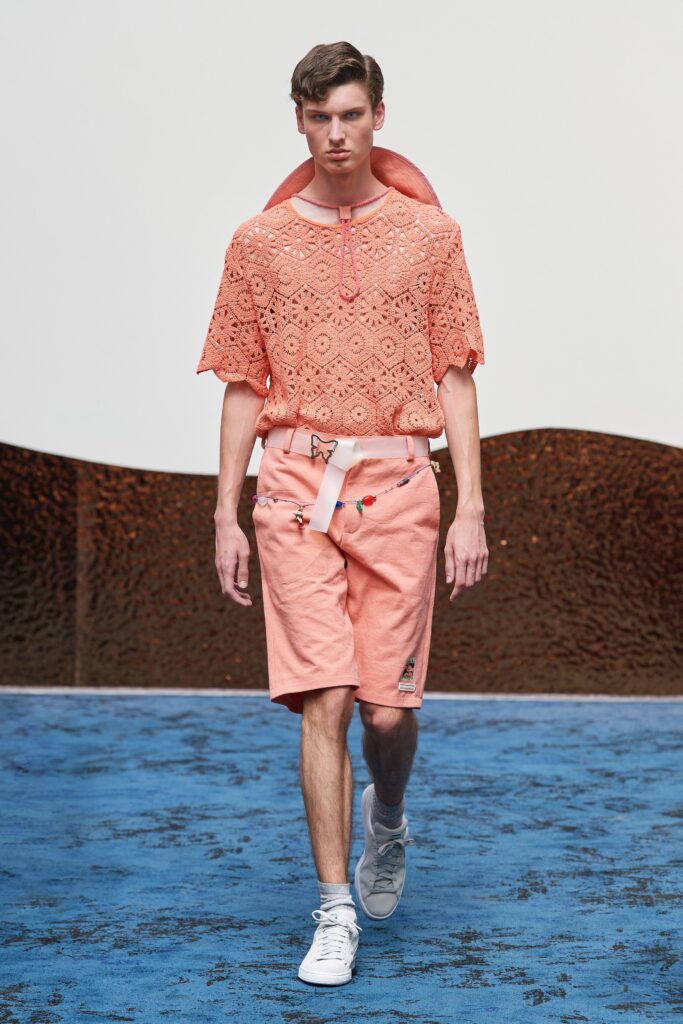 A relaxed orange embroidered top paired with matching shorts for a stylish summer look.