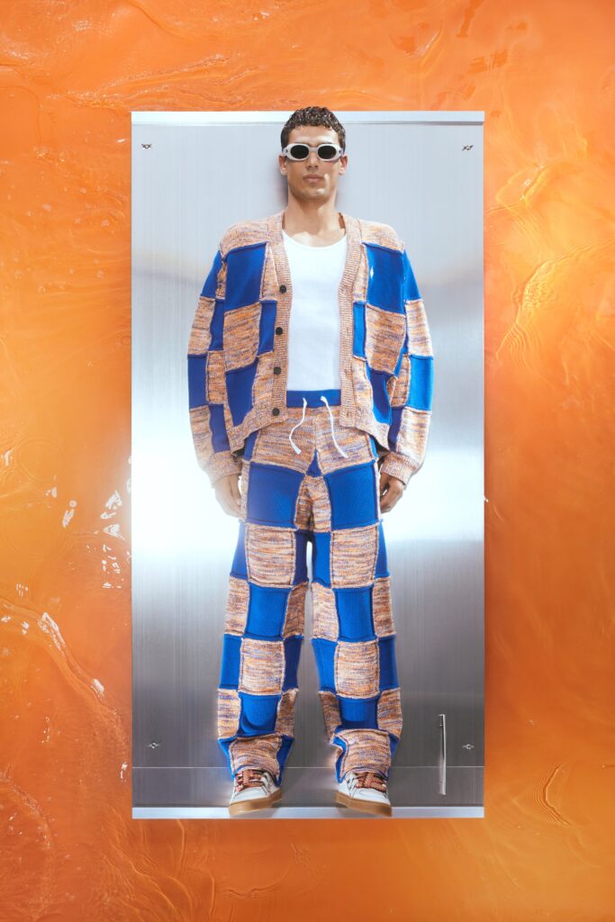 A relaxed fit blue and orange checked sweater with long sleeves paired with matching pants.
