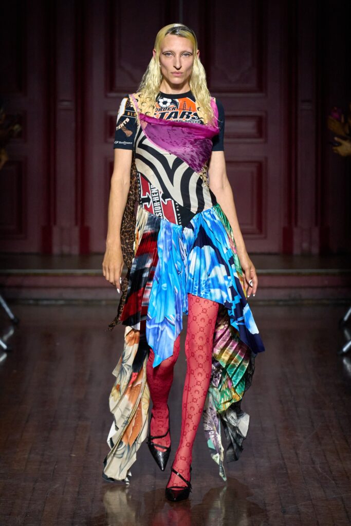 A relaxed multicolor dress with short sleeves and an asymmetric layered design.