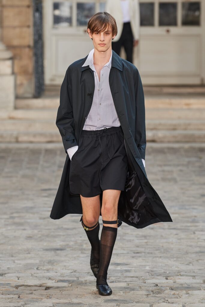 black coat with shorts and shirt