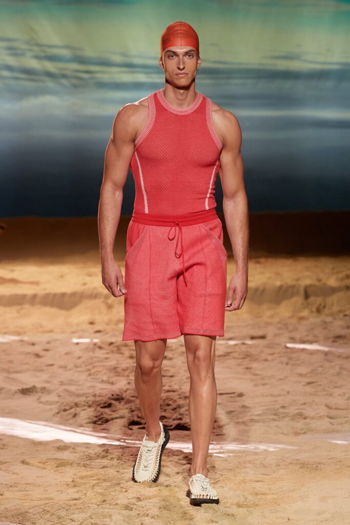 A fitted red tank-top paired with matching shorts, featuring a textured design.