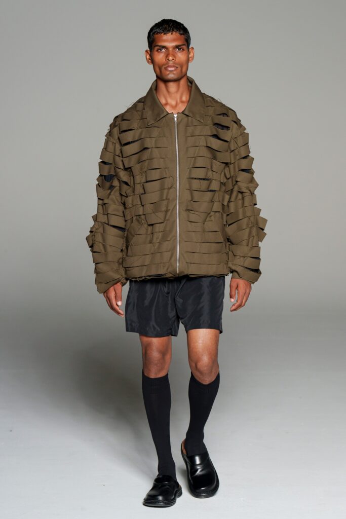 brown layered jacket with black shorts