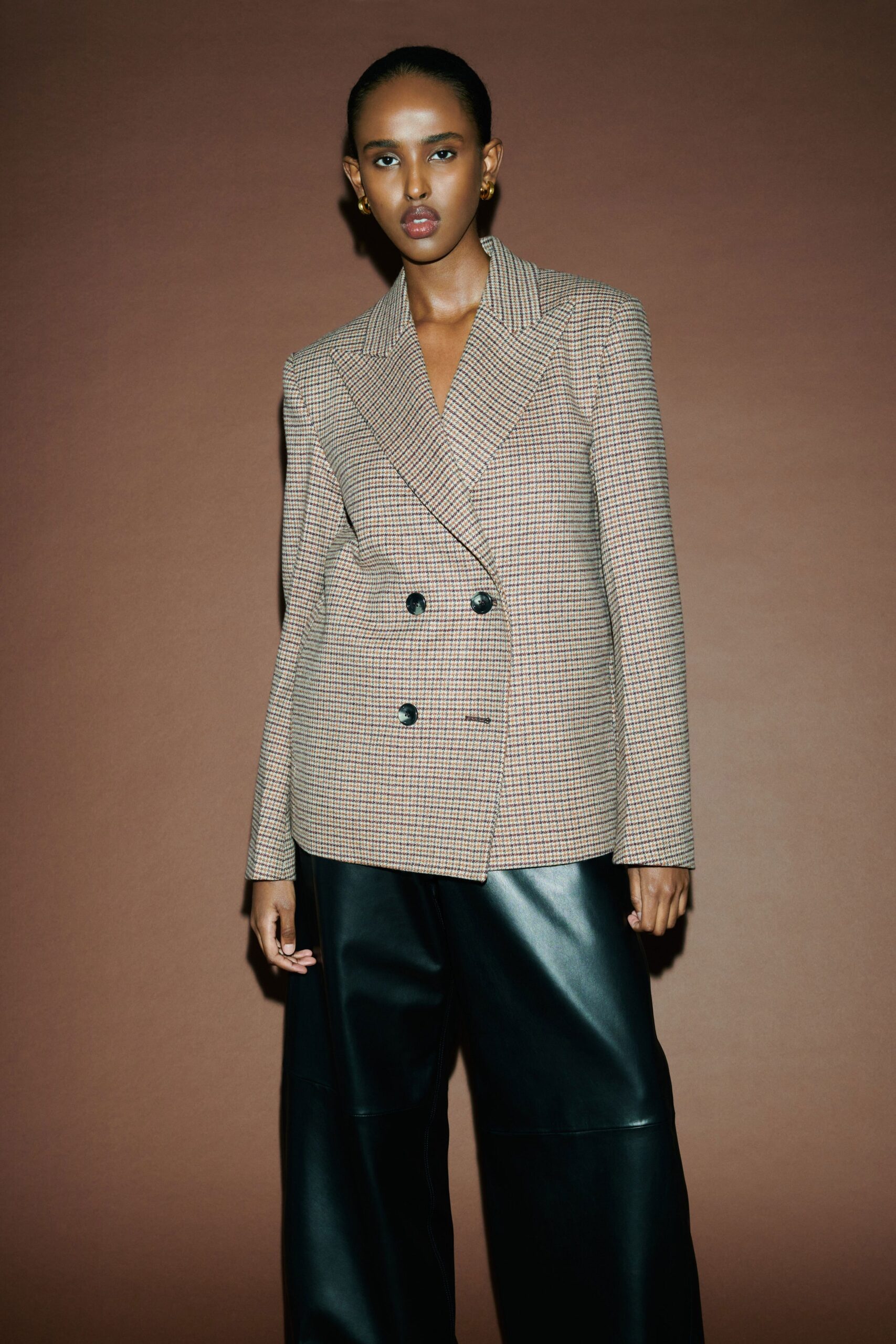 brown tweed tailored blazer and black leather pants