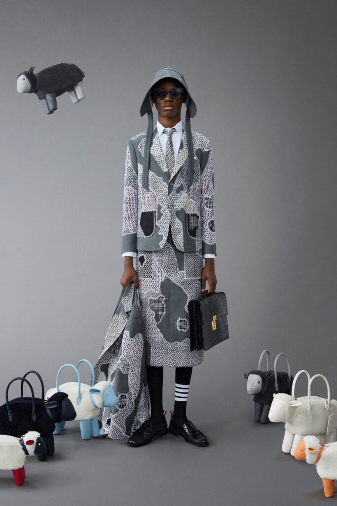 A structured gray printed suit with long sleeves and a collared design.