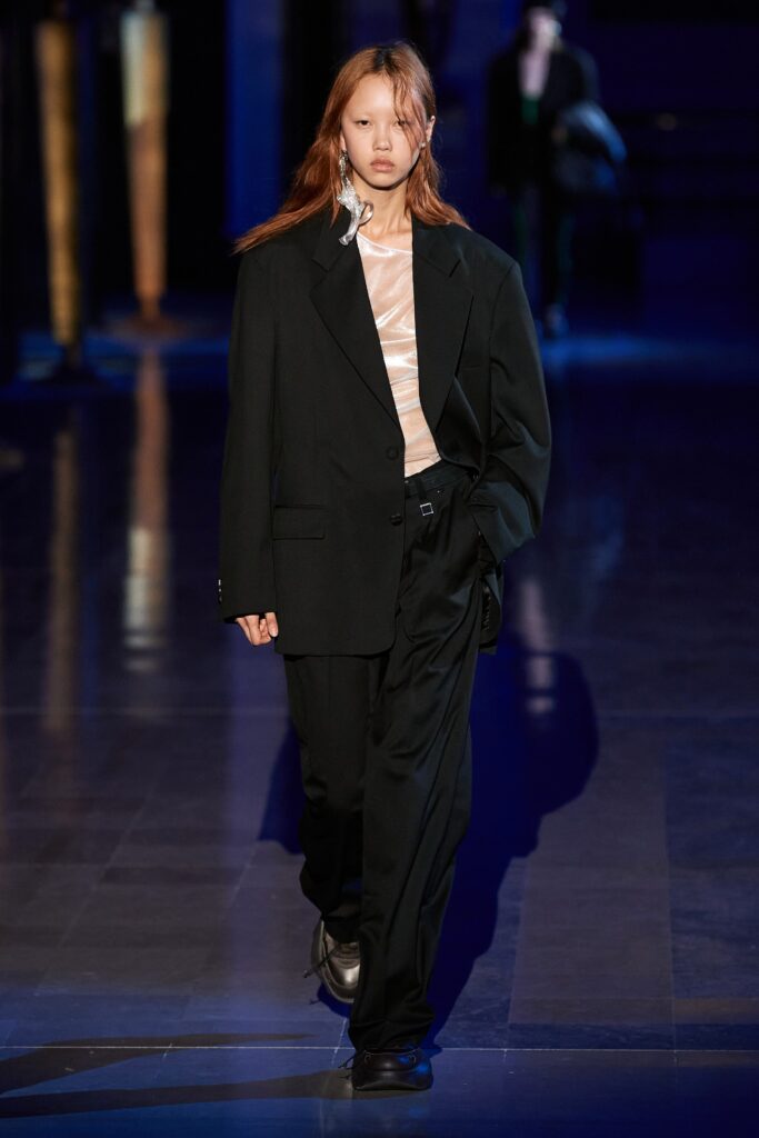 black wool relaxed suit with beige top