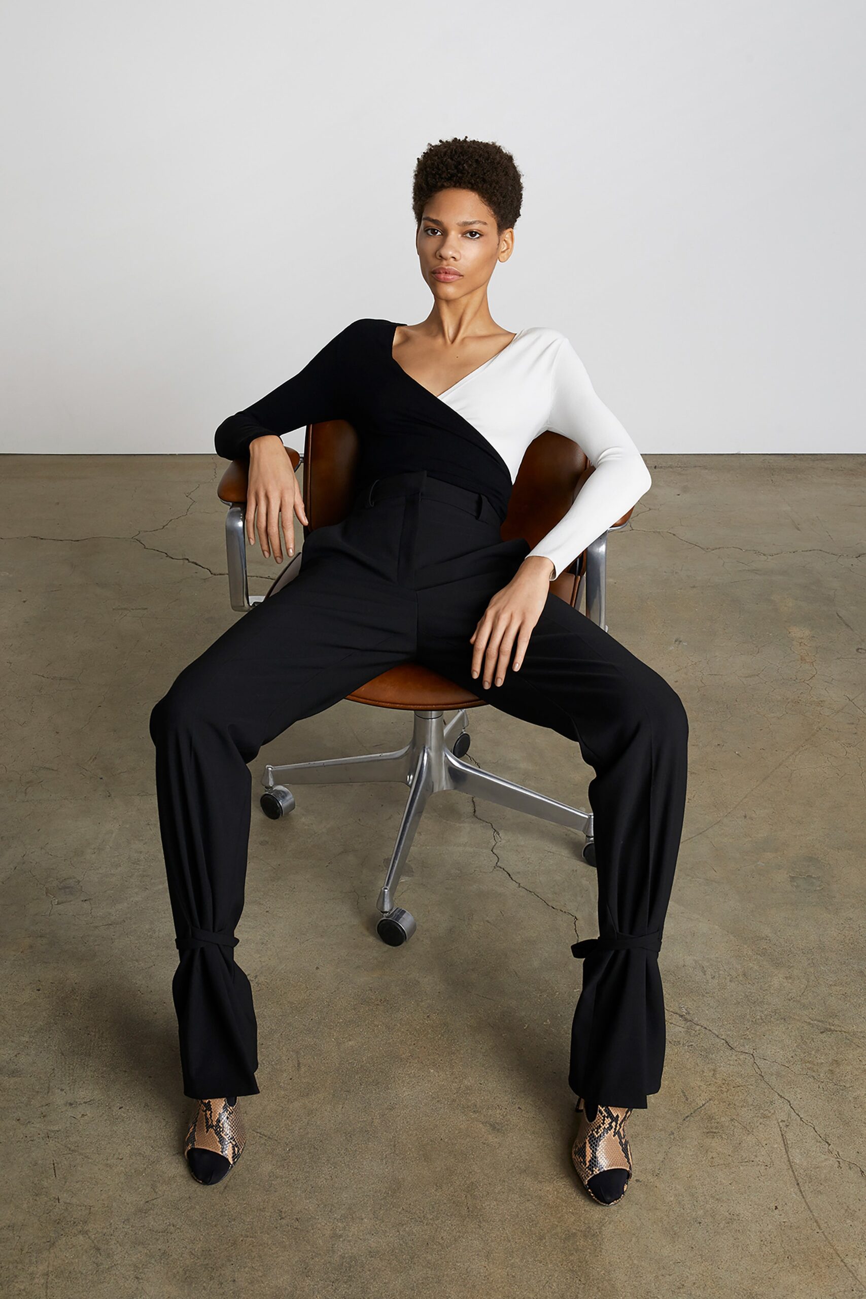 black and white asymmetric top with tailored pants