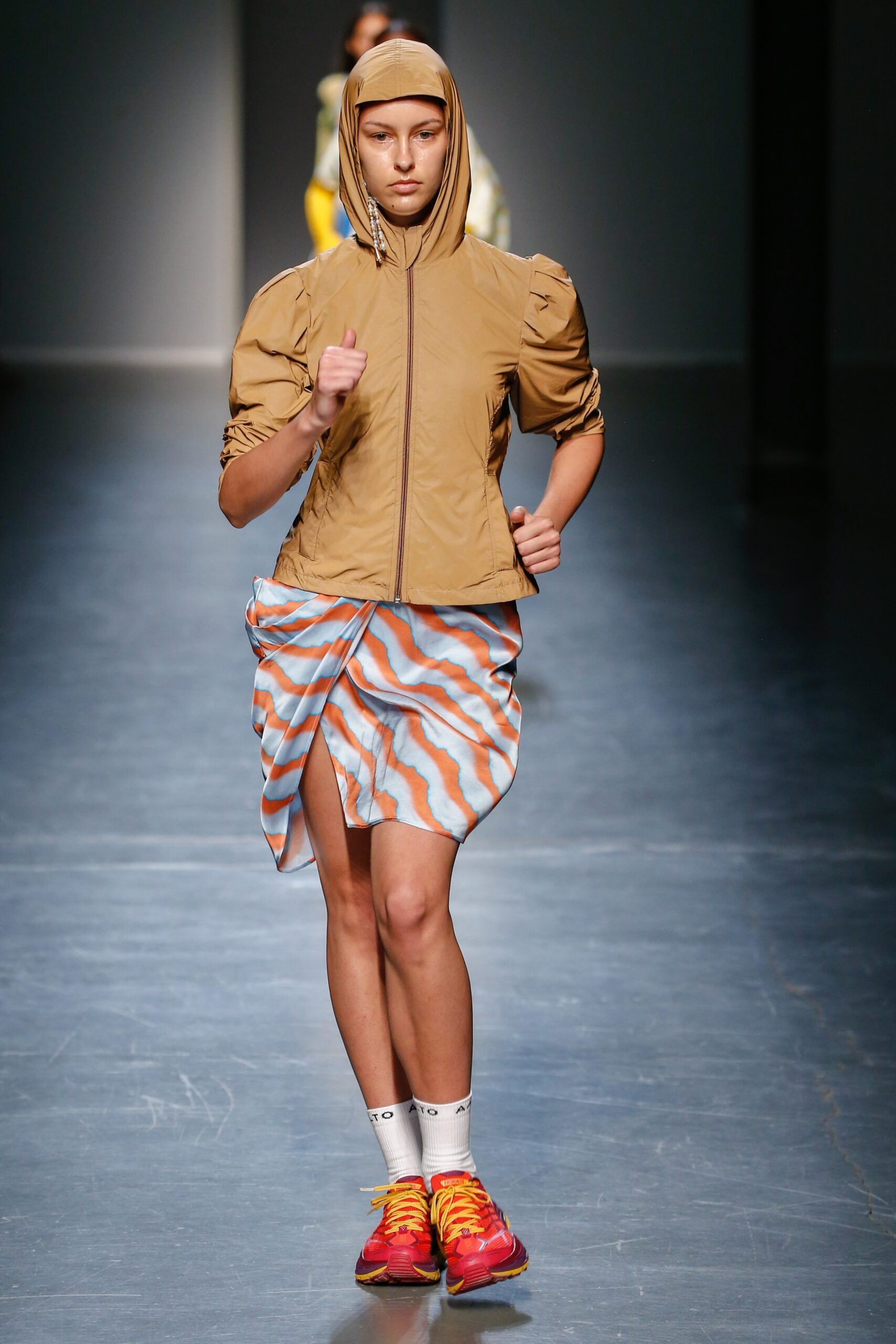 beige hooded jacket with multi skirt